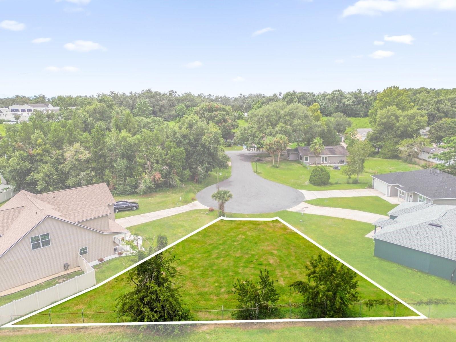 BUILDABLE LOT located on a quiet cul-de-sac with NO REAR NEIGHBORS for added privacy. No HOA. This parcel is fully cleared with no trees and comes with a current SURVEY AVAILABLE. Public water and sewer are available, making the development process straightforward. With utilities accessible and the lot ready for improvements, this homesite offers flexibility for a variety of home designs.
Conveniently located near shopping, The Villages, dining, parks, and major roadways, this lot provides easy access throughout Central Florida. Whether you are planning a primary residence, seasonal retreat, or investment property, this property delivers a clean canvas in a desirable location.
