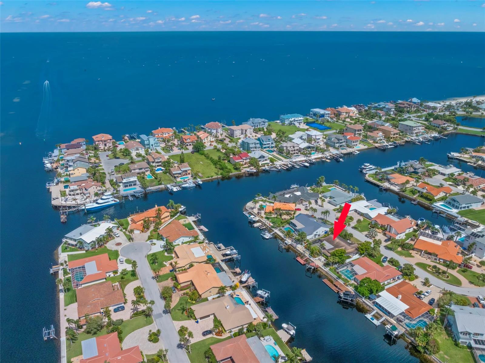 Your opportunity for a waterfront property in Gulf Harbors!! This 4BR/2.5BA/2CG pool home is in a fantastic location with direct Gulf of Mexico access just around the bend. Almost 100 feet of deep canal front can handle a variety of different boat sizes with two docks, a lift, and patio area. Large screened in pool and lanai is perfect for entertaining. Split plan ranch style home has nicely sized primary bedroom and bath with a separate dining and living room. Kitchen is open to family room and looks over the back lanai and pool area with views of the water and beyond! Guest bedroom two and three separated by a bathroom and is off hallway leading to laundry and garage. Fourth bedroom has it's own bath and gives access to the pool area. Perfect for an in-law suite. Home was impacted by Hurricane Helene and was professionally remediated and dried out. Ready for you to make it how you want! Gulf harbors has an optional membership which includes boat ramps clubhouse, and community events. An optional membership is available for a gorgeous beach a short distance away. Close to downtown New Port Richey, shopping, restaurants, and everything the Tampa Bay area offers. Don't let this opportunity get away!!