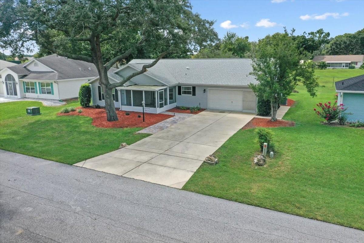 Escape before the first snow fall!! This home has been recently refreshed and ready for a new owner and quick closing. This 3-bedroom, 2 bath home includes a stunning kitchen with upgraded cabinetry, soft close features on the doors and drawers, lower slide out storage shelves, crown molding and granite counter tops. The kitchen includes a breakfast nook, 2 Pantries and a Bosch dishwasher. The floorplan features a large living room with vaulted ceiling, dining area and eat in kitchen.! The triple-split bedroom layout offers each bedroom privacy and the 3 hall closets offers ample storage. The flooring is tile in the living areas with the bedrooms and dining area offering newly installed vinyl plank flooring. The enclosed lanai includes newer windows and air conditioning offering a formal dining room or additional entertaining space for game nights! This home includes front and rear screened enclosures. Recent interior improvements include both bathrooms being remodeled, Vinyl windows with storm covers, ceiling fans with remotes and interior paint. Exterior upgrades and improvements include New Roof in 2024, Vinyl windows in 2008, Screen room and patio slab in 2023. Additional features include Leaf Filters on the gutters, irrigation system, garage service door, utility sink in the garage, insulated garage door and insulation in the ceiling of the garage. The back yard offers a park like setting overlooking the greenbelt area. Two minutes in the golf cart or a short walk and you will arrive at the amenities of Marion Landing. Amenities include bowling, swimming, exercise equipment, clubhouse activities and monthly social mixers! The monthly HOA fee includes all these amenities and your water and sewer. This is an active 55+ community in the heart of Southwest Ocala with excellent access to shopping, restaurants and medical facilities.