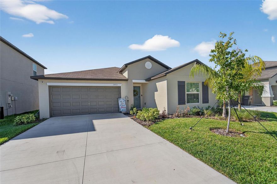 This beautiful 4-bedroom, 2-bath single-story home was built in 2024 and still shows like new! Featuring an open-concept layout, the family room, dining area, and kitchen flow seamlessly together, with ceramic tile throughout the main living spaces that enhances the light, airy feel.
The modern kitchen is a chef’s delight, showcasing sleek cabinetry, a stylish tile backsplash, stone countertops, a spacious island, and stainless steel appliances. 
A split-bedroom floor plan places the owner’s suite at the back of the home for added privacy. The suite includes a spa-like ensuite bath and a large walk-in closet. 
The 20’ x 19’ two-car garage offers plenty of room for vehicles, storage, and versatility.
Located in Balm Grove, residents enjoy lifestyle amenities designed for outdoor living, including a swimming pool, playground, dog park, and pickleball courts: perfect for year-round Florida sunshine. Close to the scenic Little Manatee River State Park which spans more than 2,000 acres which offers camping, kayaking, hiking, and endless opportunities to connect with nature. Convenient access to local businesses, hospitals, shopping, and parks makes this community an ideal place to call home.
Don’t miss your chance to rent this move-in ready home. Contact us today for more information!