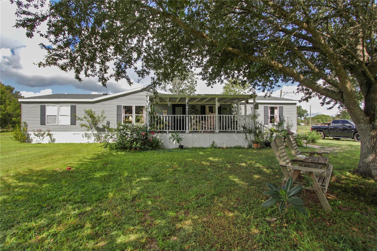Peaceful Country Living on 6.68 Acres –
Welcome to 36401 Ranch Rd, Eustis, FL – where modern comfort meets wide-open space! This beautifully updated 4-bedroom, 2-bath manufactured home offers 1,782 sq. ft. of living space and sits on a gorgeous 6.68-acre lot of flat, usable land – fully zoned for horses or livestock.
Inside, you’ll find a spacious layout with renovated bathrooms and a modernized kitchen, perfect for move-in ready convenience. Enjoy the best of both worlds with contemporary finishes and plenty of room to grow.
Step outside and you’ll love the blackberry bushes in the front yard and the towering oak trees in the back, offering natural shade over the picnic table area – ideal for weekend barbecues or peaceful morning coffee.
There’s also a barn and a shed on the property for animals, tools, or hobbies – and a John Deere riding mower is included to help you maintain your land with ease.
Tucked away in a quiet, rural setting but still convenient to grocery stores, shopping, and major highways, this property combines tranquility with accessibility – a rare find!
Don’t miss your chance to own a slice of Central Florida country living with modern updates and room to roam!