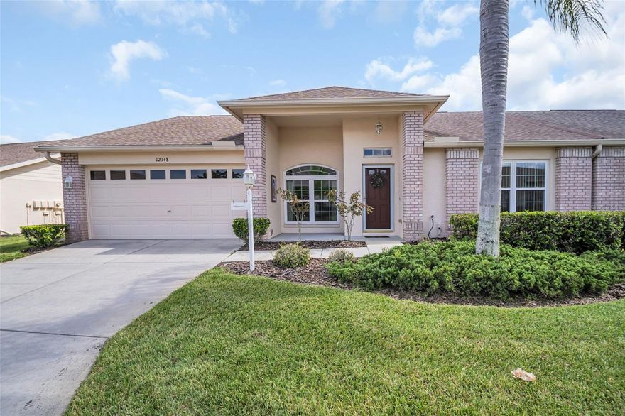 Don't miss this beautiful Villa at 12148 Arron Terrace – Heritage Springs offers Resort-Style Living for adults 55+. Welcome home to this lovely  2-bedroom, 2-bath villa nestled in Trinity’s Heritage Springs. With a single-story layout, this lightly updated residence offers the perfect blend of comfort, convenience, and lifestyle. On the inside, you will find living, dining, and kitchen spaces, ideal for easy living and entertaining. The home includes brand new appliances (2025 - never used!), updated recessed, LED lighting in the kitchen (2025), ceilings refinished (2025), Water Heater (2023), Impact windows (2021), Roof (2021), remodeled kitchen with stone counters and new cabinetry (2017) and laundry room refresh with updated cabinets and utility sink installed (2017),  HVAC (2015), Water Softener (2015), landscaping (2015), and bamboo flooring (2015). This home has a split floorplan and a generously sized master suite complete with dual walk-in closets and a private ensuite for everyday luxury. An enclosed lanai / patio is ideal for morning coffee or a nightcap in the mild Florida weather! Heritage springs offers to 55+ adults a gated and deed-restricted community with 875 acres in Trinity, Florida. The homes are surrounded by ponds and conservation areas, a golf course, and plenty of Florida wildlife. Living in Heritage Springs gives you the feeling of being on vacation year-round. Heritage Springs is a great community for a variety of reasons, including our mild winters, active lifestyle, outstanding amenities, strong financials, and easy access to Tampa area beaches and Tampa International Airport. All homeowners share in the enjoyment of all of the community amenities, including a Clubhouse, 18-Hole Championship Golf Course and Golf Pro Shop, Har-Tru Tennis Courts, Heated Pool and Spa, a Fitness Center, a Performing Arts Center, the Fountain Vue Restaurant and Sports Lounge, and an Outdoor Pavilion with Bar-B-Q Grills and Picnic Seating. There are professional onsite staff to help members take full advantage of all that our community provides and the clubhouse hosts a variety of events, such as Cards, Mahjong, Bingo, Exercise classes and the list goes on and on! Don't miss this incredible home in an amazing community! Call and make your appoinment for a tour of this lovely villa and amazing communty.