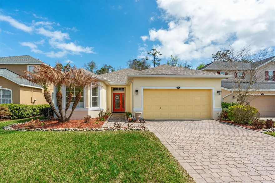 Daytona Beach Beauty in LPGA! This one-of-a-kind former custom model home is a true showstopper-blending upscale finishes with a relaxed coastal vibe. Located in the sought-after LPGA community, this single-story gem backs to a peaceful conservation area, giving you privacy & tranquil views. Grande Champion HOA offers residents a nearby community pool with cabana. Step inside the home to discover high-end upgrades throughout, including hardwood/tile floors, Custom Tile Showers, elegant crown molding, decorative tray ceilings, dual mantels with smoked mirrors, Carrara marble sills, custom master closets, Nutone Whole House Audio, Security System, finished garage with extra recessed lighting & Electrical Outlets, Hurricane Panels, & freshly painted throughout. You find refined details at every turn. The gourmet kitchen is an entertainer's dream, boasting black granite countertops, under cabinet lighting, premium stainless-steel appliances, breakfast nook & plenty of space to gather. The huge spa-inspired owner's bath is your private oasis, perfect for unwinding after a day of sun and fun. All bedrooms feature plush, high-quality carpets for ultimate comfort, while stylish new chandeliers and fans add a modern touch. New architectural roof added in 2022, hybrid water heater & garage door opener 2025 and AC in 2022. Enjoy the vibrant Daytona Beach lifestyle, world-famous beaches, NASCAR excitement, premier dining, and shopping are just minutes away. Close to Bethune-Cookman University, Embry Riddle Aeronautical University and Daytona State College. This move-in-ready home combines comfort, style, and location and is an absolute must-see!