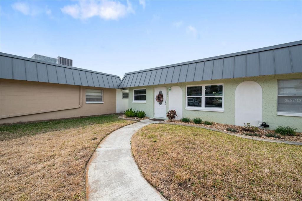 Photo of 11837 Boynton Lane #11837, New Port Richey, FL 34654 (MLS # TB8477797)
