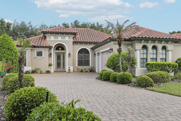 Beautiful paver driveway leading to your 3 car side garage under air with mini split