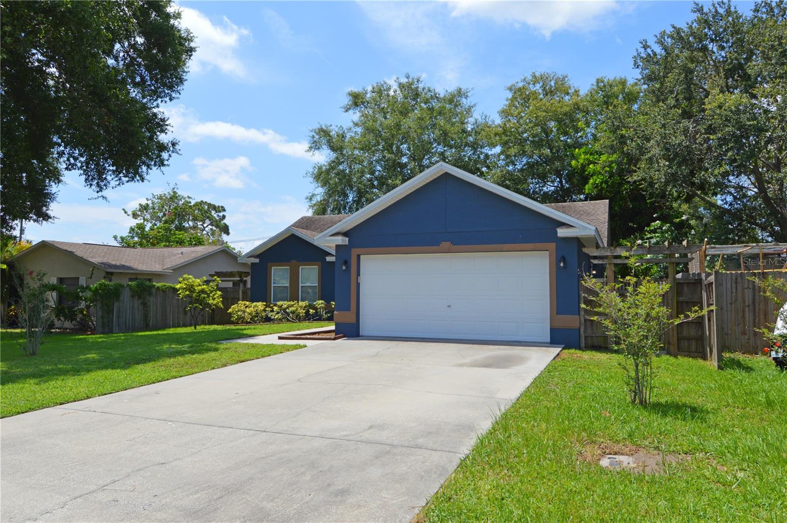 This gorgeous home is a Three bedroom and Two Bathroom 2 car garage with a fenced-in backyard has high quality features that reflect a contemporary style and a create comfortable ambiance just waiting for you. From Designer beveled mahogany kitchen cabinets, island, tile backsplash, granite countertops, stainless steel appliances, laundry room for a full-size washer & dryer, cathedral & soaring ceilings, Chair Rail and tile/wood and laminate floors throughout. Split floorplan with a huge master bedroom, his and hers big walk-in closets and master bathroom has a stand-up shower. On the other side of the home, you have the other bedrooms and bathroom with tub/shower. The backyard is completely fenced in with a covered deck. Boat and RV parking is allowed. AC system and Water heater are 2018 and Roof is 2009. This home is centrally located in Pinellas County, just minutes to shopping, restaurants, Florida's best beaches, Lake Seminole, Parks, Marinas, Colleges, Museums. and much more. Easy access to Tampa and St. Petersburg and all they have to offer.