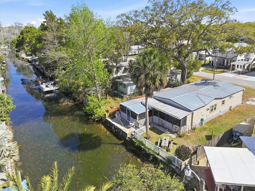 Weeki Wachee River Canal – Turnkey Short-Term Rental Investment with Owner Financing!

Opportunity meets lifestyle with this turnkey waterfront short-term rental property offering 50 feet on a Weeki Wachee River canal with direct boating access to the Weeki Wachee River and the Gulf of Mexico with no fixed bridges. Whether you're looking for an income-producing investment, a fishing retreat, or your own slice of Old Florida, this fully furnished property is ready to go.

This 2-bedroom, 1-bathroom mobile home is currently operating as a short-term rental and is being sold fully furnished, making it a seamless investment from day one. Occupancy and rental history are available for buyers seeking a proven income property.

Inside, the home features luxury vinyl plank flooring throughout, creating a durable and low-maintenance living space. Additional recent upgrades include new washer and dryer, new exterior paint, metal roof, pest and termite maintenance, brand-new ultra-quiet Energy Star Midea window A/C units in the bedrooms, and new wall heat units, ensuring comfort for guests year-round.

Step outside and enjoy the ultimate Florida waterfront lifestyle. With 50 feet of canal frontage, you can launch a kayak, paddleboard, or boat right from your backyard. The canal leads to the crystal-clear Weeki Wachee River and directly to the Gulf, offering incredible boating, kayaking, and fishing opportunities. Watch dolphins and manatees swim by, or cast a line from your dock for redfish, snook, and snapper.

Located in the charming community of Weeki Wachee Gardens, this spring-fed riverfront neighborhood feels like a step back in time to classic Old Florida living. Tucked away from busy highways yet conveniently located about 60 minutes north of Tampa International Airport, the area is easily accessed via the Suncoast Parkway.

The Weeki Wachee River, a stunning 7.5-mile spring-fed waterway, maintains a constant 74-degree temperature year-round and flows from the legendary Weeki Wachee Springs through lush natural surroundings before reaching the Gulf. Outdoor enthusiasts will love the endless activities including boating, kayaking, scalloping, fishing, snorkeling, and manatee encounters.

Owner financing is available with 20% down, 15-year amortization, 5-year balloon, and interest rate to be negotiated, creating a flexible path for investors looking to secure a waterfront income property.

If you’ve been searching for an affordable Gulf Coast waterfront investment with proven rental potential and direct Gulf boating access, this Weeki Wachee River canal property delivers both income and lifestyle in one unique package.