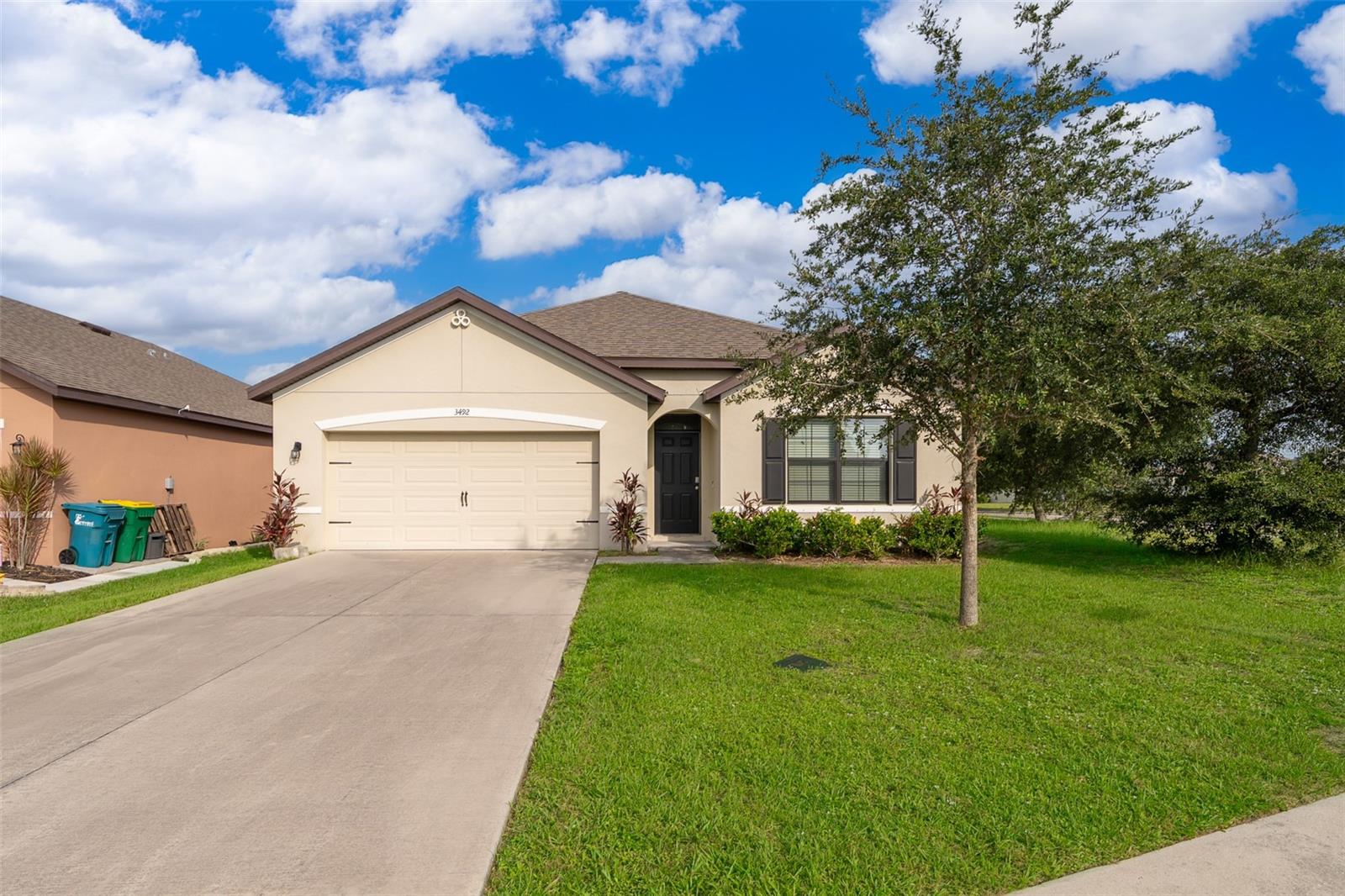 Welcome to modern living in the peaceful community of Mims, Florida! Experience the highly sought-after Cali floorplan by D.R. Horton, a thoughtfully designed one-story home perfect for comfortable family living and effortless entertaining. This beautifully crafted CORNER LOT and NO neighbors on the back residence offers 1,764 to 1,882 sq. ft. of living space, featuring 4 bedrooms, 2 bathrooms, and a 2-car garage. As you step inside, a welcoming spacious foyer leads into an open-concept living area that seamlessly combines the living room, dining space, and a stunning modern kitchen.
The expansive living room, filled with natural light from oversized windows, creates a bright, airy atmosphere with scenic views—perfect for both relaxation and hosting guests. The chef’s kitchen is a true highlight, boasting quartz countertops, stainless steel appliances, a walk-in pantry, and a large island with breakfast bar, ideal for casual meals or socializing.
Adjacent to the kitchen, the dining area offers direct access to a covered back porch, extending your living space outdoors for morning coffees or evening gatherings. The primary suite, thoughtfully positioned at the rear of the home for added privacy, includes a luxurious en suite bathroom with dual sinks and a spacious walk-in closet. Three additional bedrooms provide ample space, with one featuring its own walk-in closet, making it perfect for guests, an office, or a flex space. A second full bathroom and conveniently located laundry room complete the interior layout. This home also includes a smart home technology package, ensuring comfort and convenience with the latest in home automation. The covered back porch and generous yard space provide the perfect backdrop for outdoor living.
Located in the serene town of Mims, Florida, this home combines modern design with the charm of small-town living, while still offering easy access to nearby amenities, parks, and the beautiful Florida coast.
Don’t miss the opportunity to make this exceptional home yours—schedule your private tour today!