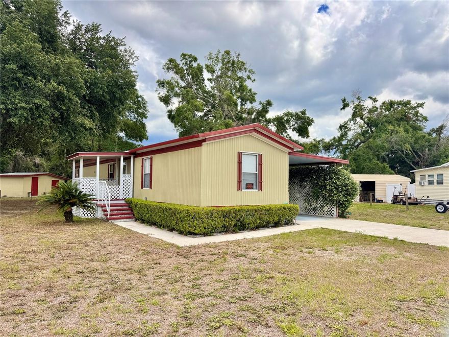 Welcome to 10113 SE 24TH Drive. A beautiful and charming 3 bedroom, 2 full bathroom home located in the heart of downtown Webster. This well maintained and move in ready home is just a short walk or golf cart ride to downtown and minutes away from the farmers market and Sumter County Fairgrounds. NO LOT RENT! This property is land owned. Plenty of parking with an oversized driveway and carport. Huge bonus with the Florida room perfect for relaxing, entertaining, or converting into a home office or hobby space. The backyard is fully fenced in which is great for pets, gardening, or family gatherings. The paver patio is great for outdoor dining or enjoying Florida's beautiful weather. There is also ample room for tools and projects with both a large attached shed/workshop and detached shed for extra storage or second workshop. Amazing opportunity to call home! Septic pumped April 2025. HVAC 2019.