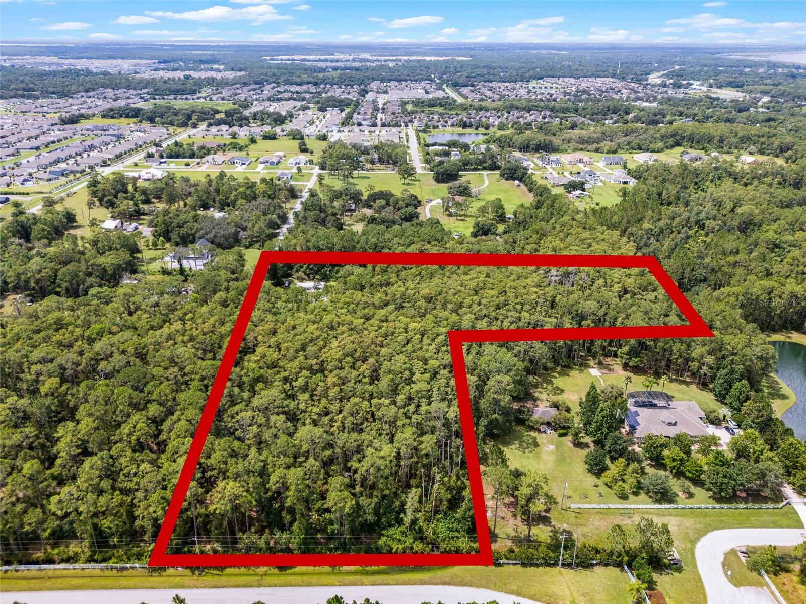 Rare opportunity to own 6.33 acres in the rapidly growing Narcoossee Corridor of St. Cloud. This property has access from 2 roads Shepherd ave, and Carson street, and can potentially be combined with another 5.33 acre lot that borders Moore Street (see listing number O6330036). This lot includes a 3 bedroom, 2 bath manufactured home built in 1984, that has been kept in great shape, ideal for rental income or use during development, or during construction of a custom home, and a metal barn. Currently zoned AC in the Eastern portion on the land and R-2 on the West 2 acre lot, the property holds a Future Land Use designation of Low Density Residential, and the county has suggested rezoning to Urban Fringe, which would allow up to two homes per acre. This makes it an excellent candidate for a custom home community or large-lot residential development. Located just minutes from Lake Nona’s Medical City and surrounded by new growth, this parcel is perfect for builders, investors, or families seeking space and long-term opportunity in a high-demand area. Why buy a 0 lot property in Lake Nona when you can have your own private oasis in the middle of the city?. This lots offers a strong foundation for long-term investment. Located just minutes from Lake Nona’s Medical City and surrounded by new growth, this parcel is perfect for builders, investors, or anyone looking for space and opportunity in a high-demand area.