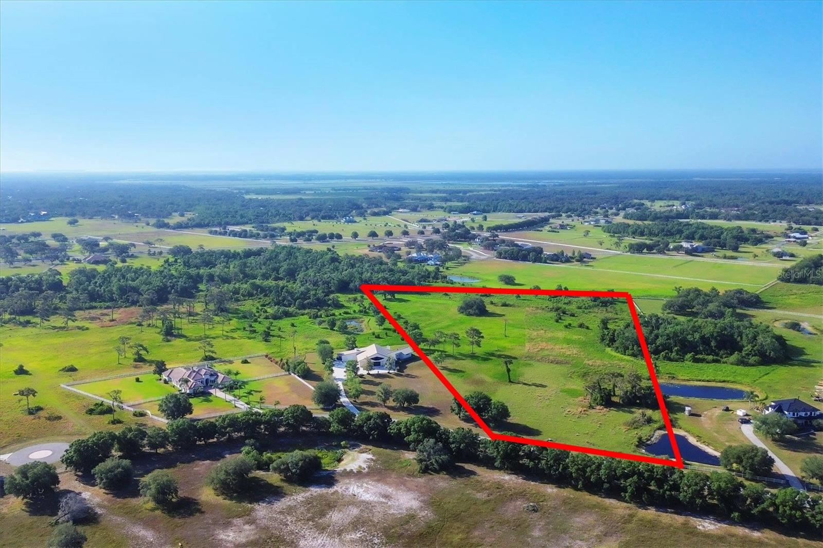 Discover the perfect canvas for your dream home with this stunning parcel of over 10 acres of land, offering a serene escape from the hustle and bustle of city life. Your journey begins with a scenic drive through the picturesque countryside, where winding roads gently curve through serene landscapes. Experience a true equestrian lifestyle with miles of bridle trails right at your doorstep. Sarasota Ranch Club offers a gated community, deed restrictions, and minimal HOA fees, perfect for anyone trying to build a custom built home, a relaxing rural retreat, or an incredible family estate. This location makes it easy to access major highways to explore the sandy gulf beaches, fine dining in Sarasota, a weekend escape in Tampa, and so much more. If you are looking for an opportunity to build your dream estate this is just what you are looking for!