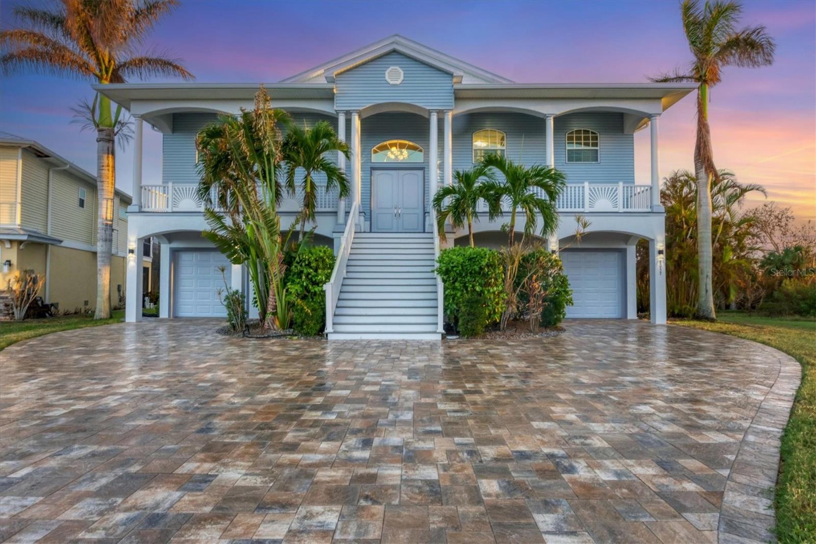 Motivated Seller! A Luxury Statement of Waterfront Living! POOL HOME! FULLY FURNISHED! Public Water and Public Sewer! GREAT ELEVATION! GATED!ONE OF THE KIND!It is located in Hidden Waters, a gated waterfront subdivision on Oyster Creek. NEW impeccable 2-Story Key West Style Beauty nestled along Oyster Creek behind the gates of the exclusive Hidden Waters Subdivision. Spacious custom 4 BR, 3½ BA home with contemporary flair built to the newest hurricane and energy efficiency standards. Solid concrete foundation with fully enclosed 2+ car garage. Elegant split entry stairs leading to spacious, wide open living area with gas fireplace and glass sliders opening to the huge 56x13 ft. A 2-story cage embraces the heated 34-foot pool, Jacuzzi & outdoor gas fire pit. Kitchen with bar island next to dining area. Also on main floor: office with French doors, powder room, large laundry and a spacious master suite with drop-dead gorgeous bath w/shower & tub, plus two custom WICs. Downstairs are 3 guest bedrooms, 2 bath & a lounge. All downstairs bedrooms with custom WIC & direct access to pool & large sundeck. Same neutral 20” tile throughout the whole house, all doors and sliders 8 ft. high, & all bedrooms with tray ceilings. There is a little beach area with Coconut Palms, a bond fire pit, & a long walk way leading through a mangrove belt to the private boat dock with a new 7000 LB boatlift. Short 3600-foot boat ride to the Intracoastal Waterway & beaches. Discover the nearby pristine Gulf beaches, where you can bask in the sun, partake in water activities, or simply relish the tranquility of the ocean. Embark on nautical adventures from the conveniently located marinas, allowing you to explore the region's captivating waterways and nearby islands. Fishing enthusiasts will delight in the world-class fishing opportunities, while golf enthusiasts can indulge in a variety of renowned golf courses.Englewood is known for its thriving shopping and dining scene, featuring a diverse range of retail centers, boutiques, and restaurants. Immerse yourself in the vibrant downtown area, boasting charming shops, art galleries, and entertainment venues. The city hosts numerous cultural events, festivals, and community gatherings throughout the year, ensuring there's always something exciting happening. Beyond the city's amenities, this vacant lot offers proximity to breathtaking nature parks and preserves. Englewood also boasts excellent educational institutions, reliable medical facilities, and convenient transportation options. The city's welcoming community and strong sense of belonging make it an ideal place to establish roots and create lasting memories. Experience the best of Florida living, with nearby beaches, golf courses, and outdoor recreational activities just a short drive away. Don't miss out on the chance to own this extraordinary home.