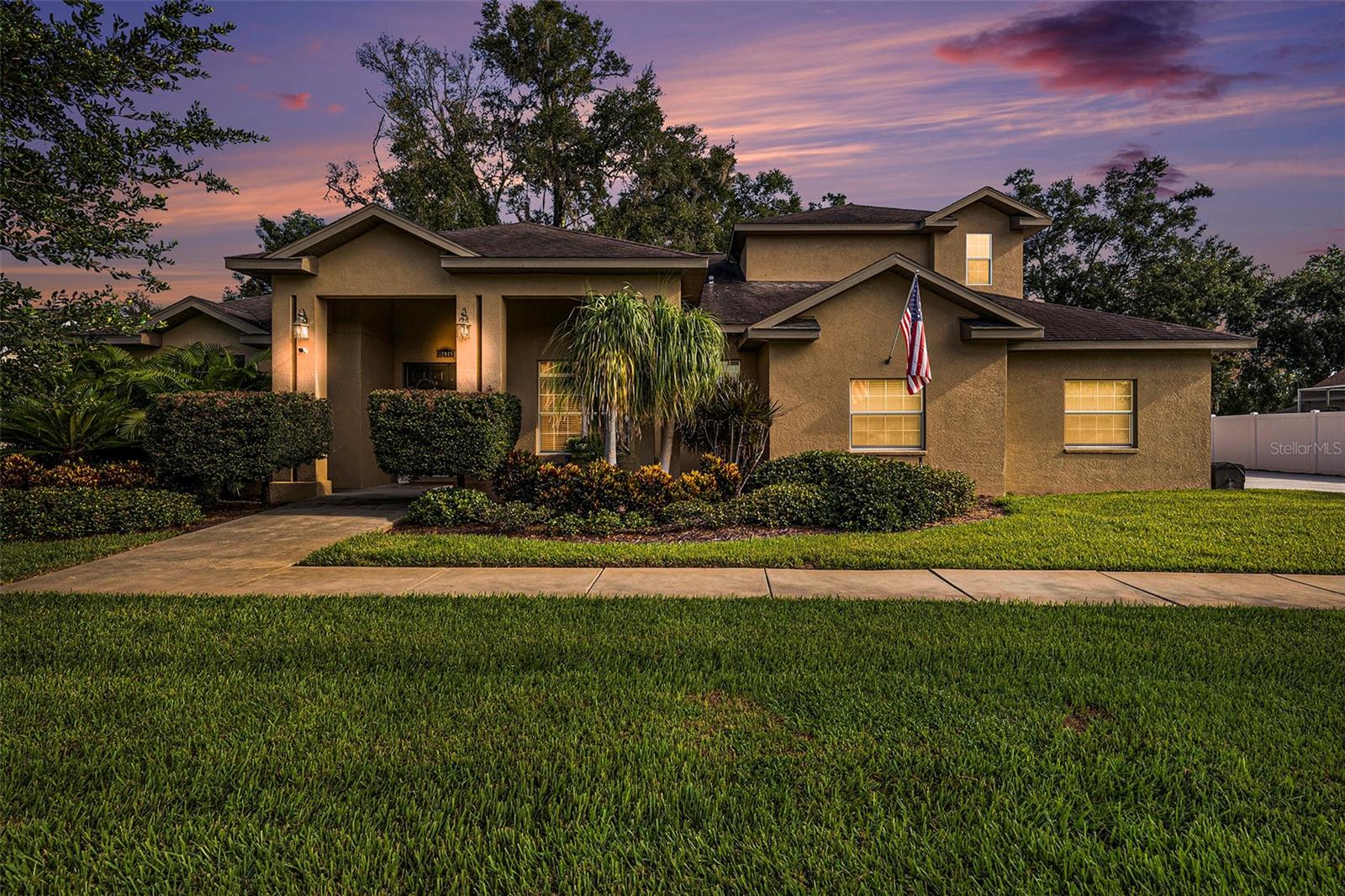 Spacious Custom Home with 5 Bedrooms, 4-Car Garage & Private Backyard Retreat! Seller will replace the roof with an acceptable offer—giving you peace of mind from the start. This custom-designed home offers flexibility, space, and style with 5 bedrooms + bonus rooms, 4 full bathrooms, and a rare 4-car garage setup (2 attached, 2 detached). The main floor features a split-bedroom layout with 4 bedrooms and 3 baths, while upstairs offers a versatile bonus room or secondary master suite with its own private bath. The heart of the home is the spacious kitchen boasting an abundance of cabinetry, modern appliances, and a butler's pantry—perfect for entertaining or everyday living. The primary suite includes a luxurious tiled, no-step walk-in shower, dual vanities, and 2 generous walk-in closets. Panoramic backyard views shine through cascading sliding glass doors that pocket to seamlessly blend indoor and outdoor living. The detached 2-car garage includes a finished second-story bonus room complete with its own bath and mini-split A/C—ideal for guests, a home office, or game room. Pool table and sectional are optional. Step into your private backyard oasis featuring a screened lanai, gazebo, and firepit for year-round enjoyment. Low HOA fees, No CDD—just space, style, and flexibility in a beautifully crafted home.