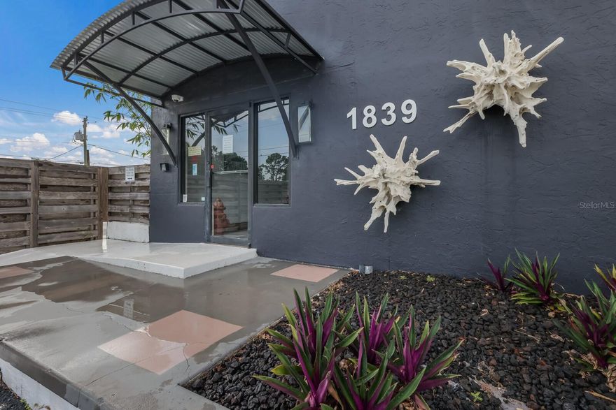 1839 61st Street in Sarasota, Florida, is a luxury showroom, office, warehouse and light industrial building that’s located just minutes to downtown Sarasota, Sarasota Bradenton International Airport, the I-75 Interstate Highway and The Mall at University Town Center development area. Property is owner-occupied and has been for many years. There is an abundance of parking on the property for guests and a gated secure parking lot/delivery area for employees and delivery personnel. There are two adjoined buildings that are both air-conditioned. The building’s showroom and offices are built of full masonry construction and boast 14-foot ceilings. This structure currently features a glass conference room, premium stone floors, a private, glass-enclosed executive office; used as an accounting department, product sample areas, multiple private offices, custom-designed architectural work stations, product display areas, an expansive cut and sew, fabric production area located on a second-floor loft, an upscale kitchen and dining area, and a warehousing area with 20-foot clear span ceilings. There are also a number of designer baths located throughout the facility. Adjoined to the showroom and offices is an air-conditioned warehouse with a 20-foot clear span ceiling height, depressed loading dock, and multiple delivery doors. The 52,184-square-foot parcel, which totals 1.2 acres, is located in an X flood zone (500 Year), which is very favorable. Please note: because it's been owner-occupied, we do not have an investor rent schedule.