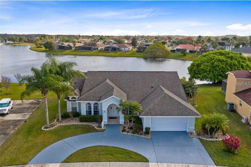 Beautiful spacious lakefront 4/3 home in the desirable Hunter's Creek community. The home features formal living and dining areas, an open-concept layout in the family room, kitchen, and breakfast nook. The large covered patio can serve as both your gym and playroom. A screened sunroom is perfect to enjoy the FL water view with your morning coffee. Come to see and make this your home.  *Equal Housing Opportunity.