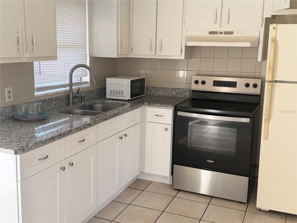 Photo of 4318 Colony Way, Orlando, FL 32808 (MLS # O6453431)