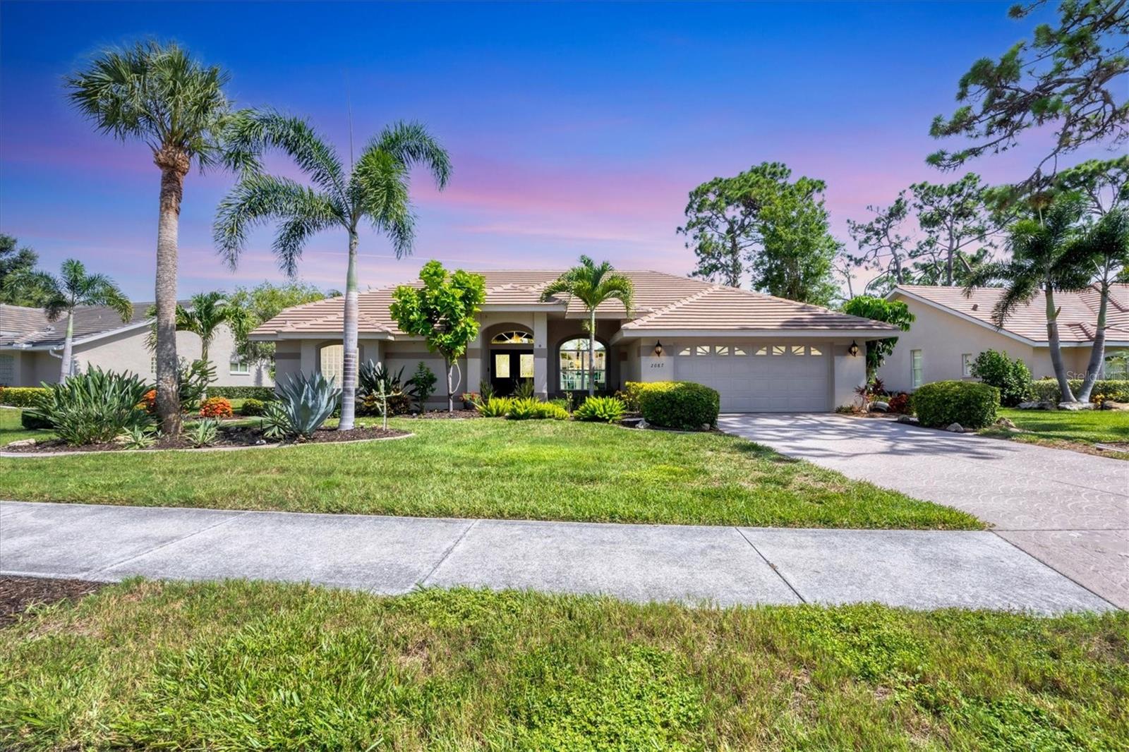 One or more photo(s) has been virtually staged. Welcome to your private retreat in the coveted, gated golf community of Calusa Lakes. Nestled among mature trees and tropical landscaping in maintenance-free Woodland Trails, this beautiful 3 bedroom, 2-bath with almost 2300 sq.ft. home offers a serene WATER VIEW overlooking the 5th hole tea box of the Calusa Lakes Golf Course. Relax in your own private spa in your screened in lanai during the evenings and during the day you have access to your heated COMMUNITY POOL for sunbathing and swimming. This lot is also large enough to build your own pool. NEWER TiLE ROOF (2018), NEW Hot Water Heater (2025) and recently serviced and maintained HVAC. Inside, you will find an open concept layout with high ceilings, a spacious kitchen with breakfast bar, and a bright living area with expansive sliding doors that let in natural light. The split bedroom plan offers privacy, with a generous primary suite that includes lanai access, a garden tub, separate walk-in shower and dual vanities. Calusa Lakes is one of Nokomis's most desirable communities, conveniently located near the Gulf of Mexico, fine dining, boutique shopping, cultural attractions, and the newly opened Sarasota Memorial Hospital. This exceptional neighborhood features majestic shade trees, scenic lakes, well-kept homes, a semi-private golf course, and clay tennis courts. Whether you’re looking for a full-time residence or a seasonal getaway, this distinguished property in Calusa Lakes is the perfect Florida retreat.