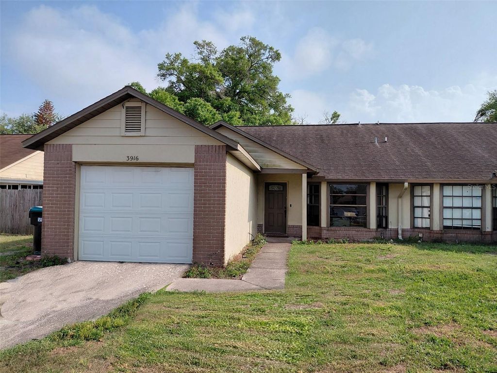 Photo of 3916 Magnolia Lake Lane, Orlando, FL 32810 (MLS # R4910986)