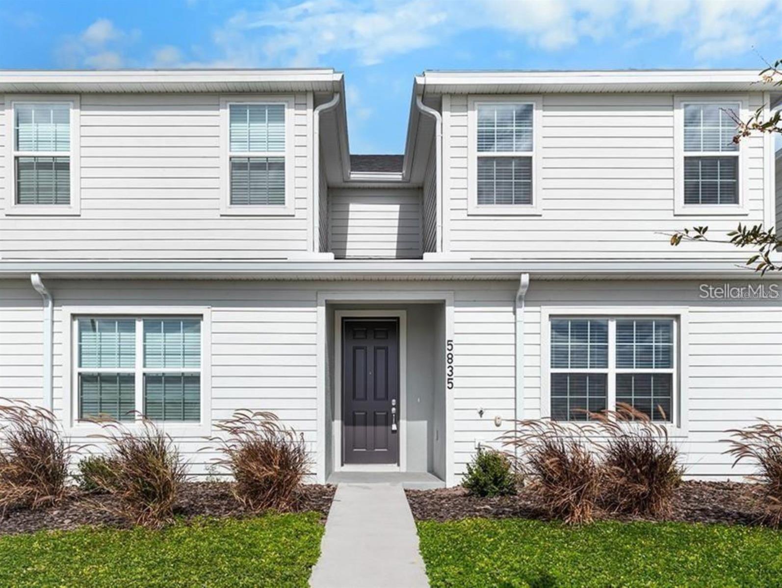 Under contract-accepting backup offers. 2-story new construction townhome with 1,705 square feet, 3 bedrooms with loft, 2.5 baths, a 2-car garage, located in the brand-new Crossings community offering natural and park amenities. Downstairs, a gourmet kitchen with Cambria countertops, shaker-style wood cabinets, Samsung stainless steel appliances, and a pantry. The entire lower level and upstairs baths are finished with luxury vinyl plank flooring, with stain-resistant carpet in the bedrooms. Upstairs, you'll find three spacious bedrooms including your owner's suite complete with a walk-in wardrobe, linen closet, and a private en-suite bath with dual vanities and a tiled shower. Additional features for your convenience include a half bath downstairs, loft, custom-fit window blinds throughout, a Samsung full-sized washer and dryer, energy-efficient insulation and windows, and a full builder warranty.