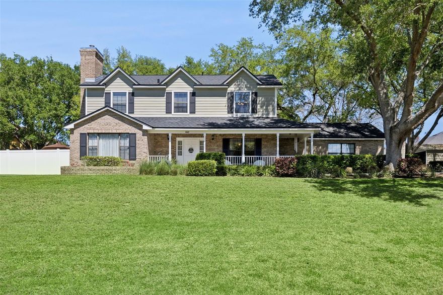 This classic two-story pool home offers timeless curb appeal, generous space, and the freedom of .72 acres with no HOA. Featuring 4 bedrooms, 2.5 bathrooms, and 2,108 square feet of living space, the property provides a well-balanced layout designed for both everyday living and entertaining. Inside, you’ll find beautiful hardwood flooring, authentic wood trim and doors, and a formal living room with a wood-burning fireplace that creates a warm focal point. A separate formal dining room provides dedicated gathering space, while the spacious family room on the opposite side of the home allows for comfortable, casual living. The kitchen is equipped with solid wood cabinetry, granite countertops, tile flooring, and newer stainless steel appliances, offering both durability and function. All bedrooms are positioned upstairs, including the primary suite with its own attached bath. Outdoor features truly set this property apart, with a large private pool, screened back porch, welcoming front porch, and expansive yard space offering flexibility for recreation, gardening, or future enhancements. In addition to the attached 2-car garage, there is a detached workshop and an additional 2-car carport, providing exceptional storage, hobby, or workspace options. The home is on a well, offering long-term utility efficiency, and is situated with comfortable spacing between neighboring properties while remaining conveniently close to shopping, dining, medical facilities, and everyday amenities. Meticulously maintained and full of character, this property presents a rare opportunity to enjoy space, privacy, and versatility in a highly accessible location. Major updates include a newer roof (2022), new AC system (2025), fresh interior and exterior paint (2022), hot water heater (2024) new well pump (2024), replumbed several years ago.