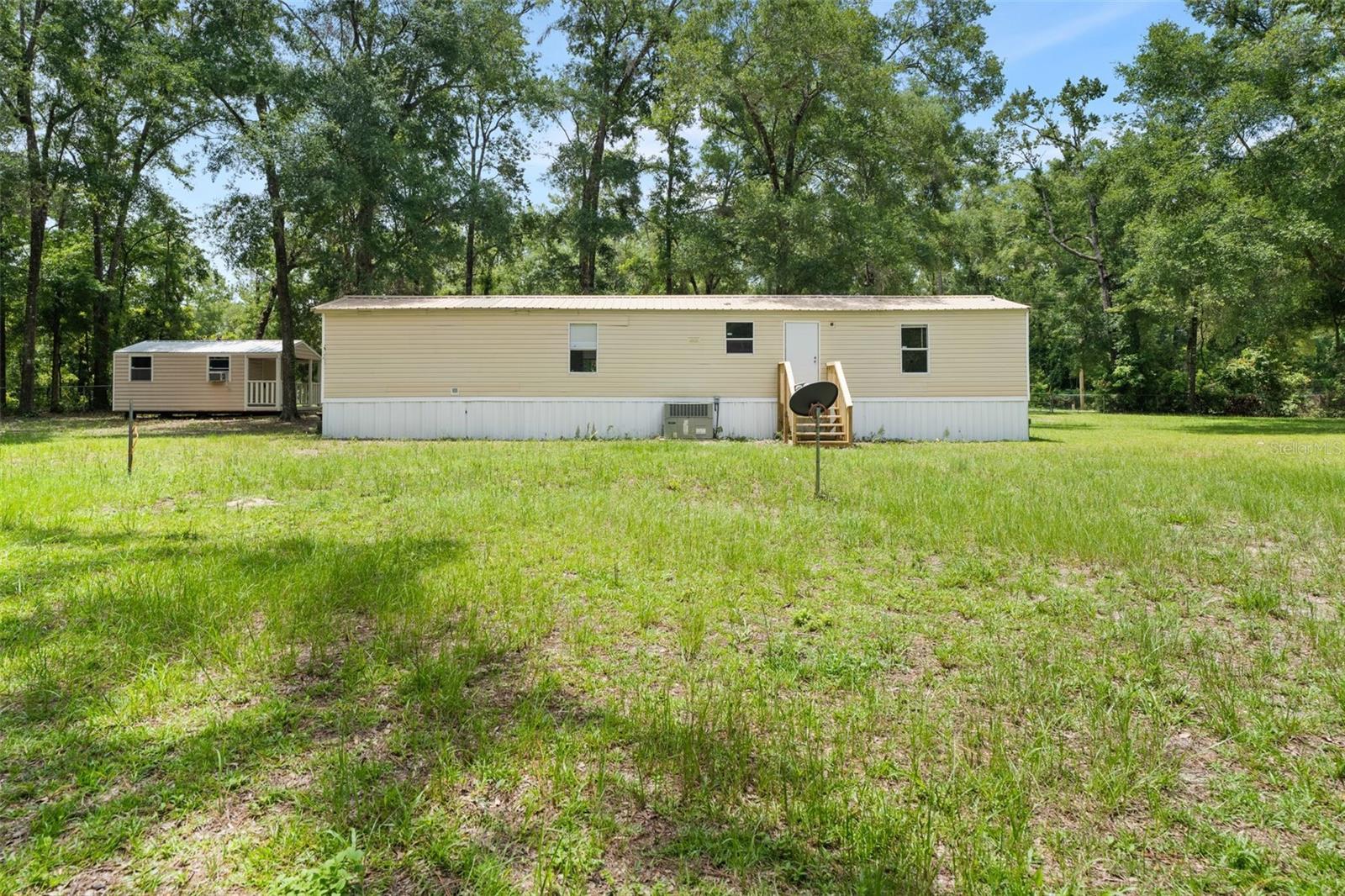 Welcome to your new home, vacation retreat, or investment property. This completely remodeled, turnkey residence is ready for you to enjoy as you can tell from the pictures. The property offers space for your recreational, animals, and more. A large metal building at the back provides storage for vehicles, boats, golf carts, and other equipment, while a spacious shed offers additional storage options. There are four camper hook-ups with electric and water. You can camp on the property 4-6 months out of the year. Take advantage of tubing down the crystal-clear Ichetucknee River or kayaking along the Santa Fe River through private parks accessible with an annual $175 membership. Three Rivers Estates is a distinctive community featuring parks along the Santa Fe and Ichetucknee Rivers, with two private boat ramps on the Santa Fe River. Enjoy excellent tubing, kayaking, and swimming in the pristine Ichetucknee Spring River. Three Rivers Estates is a golf cart-friendly neighborhood that includes deeded access to private boat ramps and parks along the Santa Fe, and Ichetucknee Rivers. Spend your days swimming in-clear springs, kayaking through picturesque waterways, or relaxing by the riverside. This is an awesome property. Schedule your private showing today!