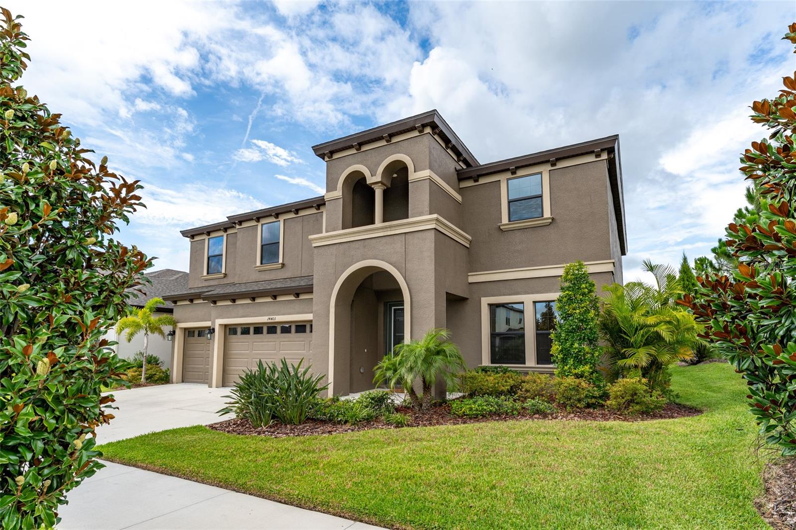 Welcome to the exquisite Virginia Park floorplan by West Bay Homes—where luxury meets comfort in the heart of the highly sought-after Hawkstone community! This stunning 5 bedroom, 4-bath with office home offers elegant design and a thoughtful layout that blends spaciousness and function. From the moment you arrive, the upgraded elevation, charming front porch, and tranquil park views welcome you home. Inside, enjoy soaring ceilings, upgraded tile flooring, and abundant natural light throughout the open-concept living space. The front office/flex room easily converts into a 6th bedroom. The gourmet kitchen is a chef’s dream—featuring a massive island, high-end appliances, extended quartz counters, an abundance of upgraded cabinetry, designer backsplash, and a large eat-in area overlooking the expansive living room. A guest suite with full bath (pool bath) sits privately off the main living space. Step outside to a spacious covered lanai with a serene water view—perfect for relaxing or adding a future pool. Upstairs, be wowed by the oversized bonus room, 3 secondary bedrooms, and a luxurious owner’s retreat. Two bedrooms share a Jack & Jill bath, while another has its own adjacent full bath. The HUGE master suite offers true privacy with a large ensuite featuring dual sinks, a super shower, garden tub, and huge walk-in closet. The upstairs laundry room adds ultimate convenience. Enjoy all of Hawkstone, including resort-style pools, top-rated schools, parks, and trails—all within minutes of shopping and dining. Don’t miss your chance to call this masterpiece home!