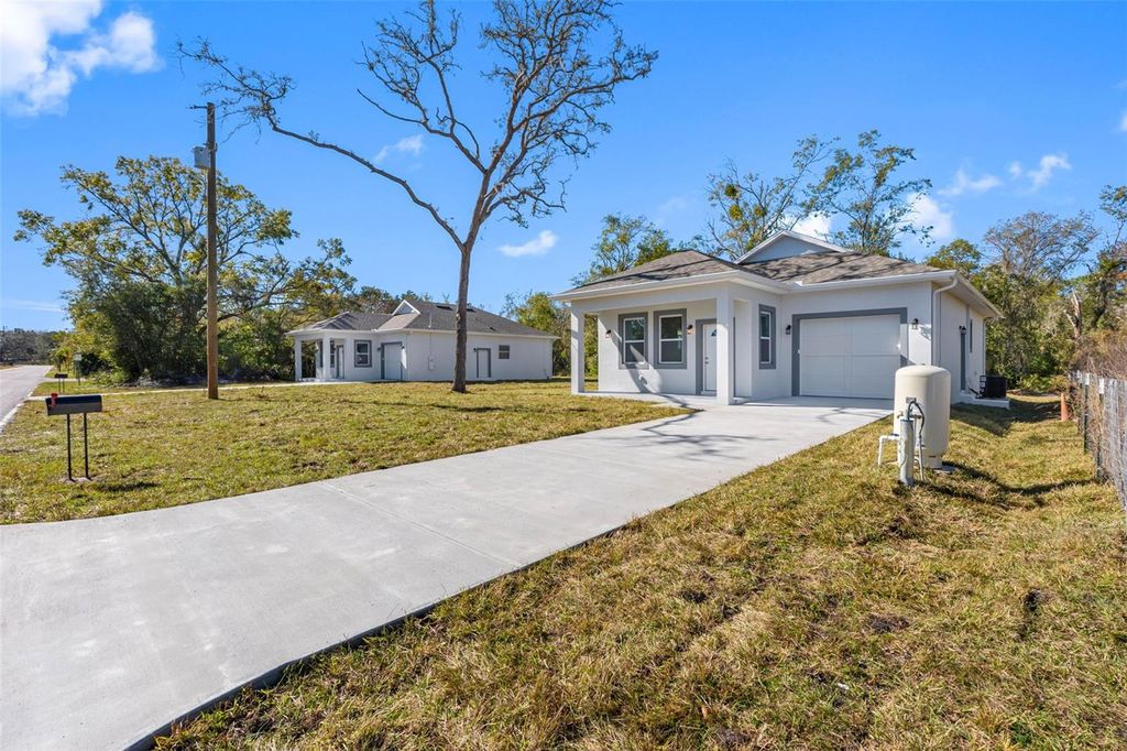 Photo of 10271 Lake Drive, New Port Richey, FL 34654 (MLS # TB8458832)
