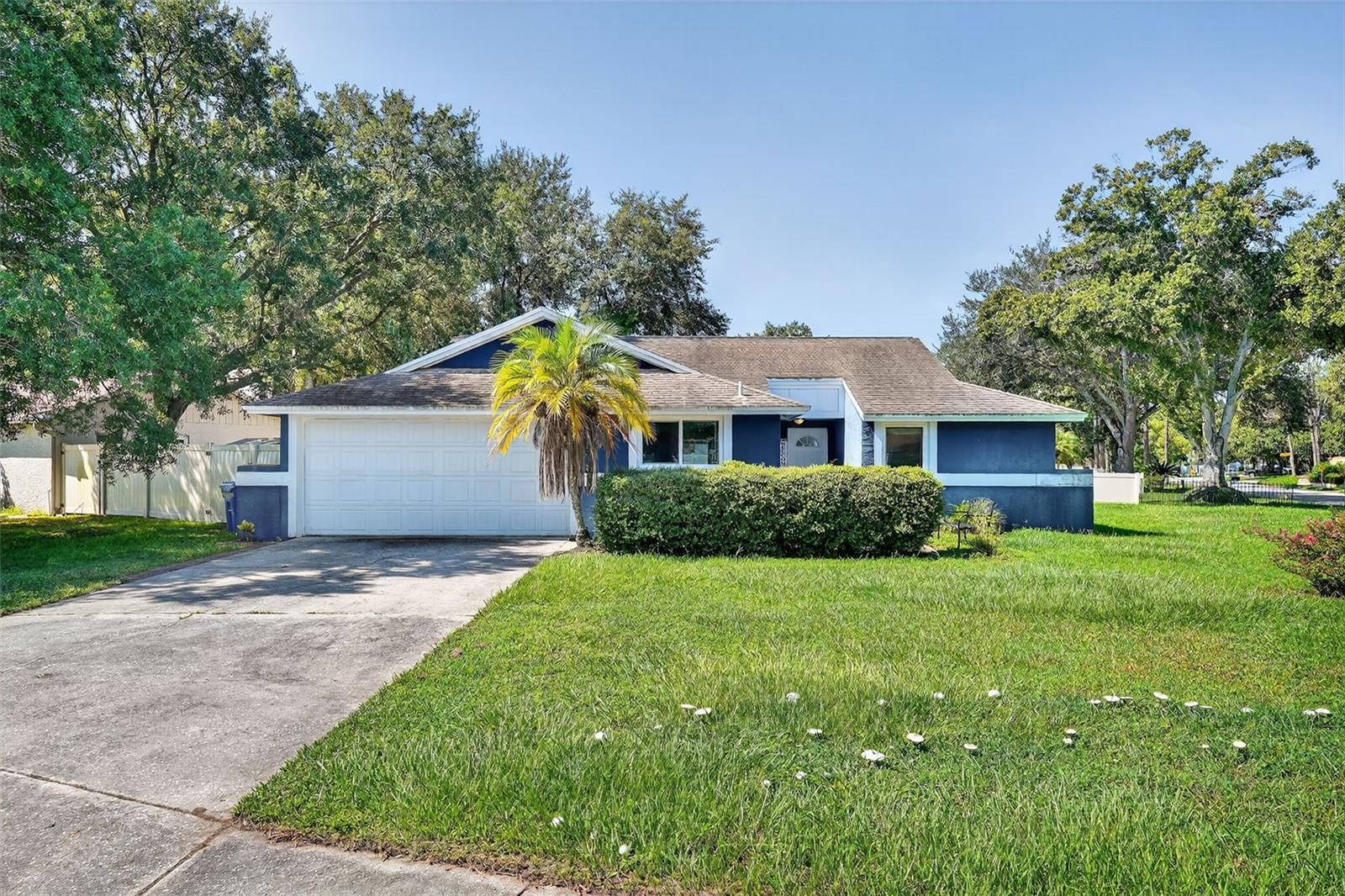 Hurry! Hurry! Welcome to Country Run, an ideally situated neighborhood in Carrollwood near shopping plazas, restaurants, and quick access to the Veterans Expressway. This 3-bedroom, 2-bathroom home sits on an oversized corner lot, minutes walk to the Country Run park. Step inside to the open layout that offers both comfort and style. The living room and dining room share the open space with huge vaulted ceilings. The split floor plan ensures privacy with the master suite on one side and the two guest bedrooms on the opposite side. The owner has enclosed the laundry room into an accessible indoor room. The two car garage has also been converted into a 4th bedroom but can easily be converted back if needed. The large screened enclosure welcomes you to the backyard that comes with two sheds. This property provides the perfect canvas to add your own personal touch and charm. NO HOA, or CDD fees, just a short drive to Tampa International Airport, and a mere 30 minute drive to Florida's nationally recognized beaches.