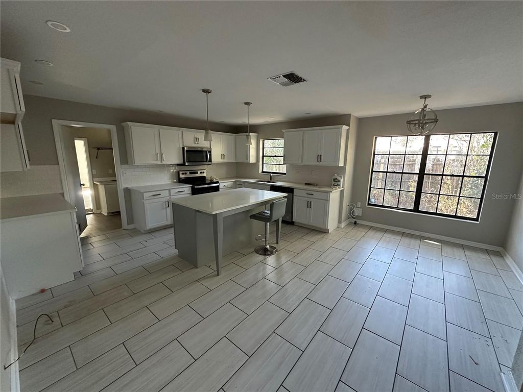 Photo of 1423 Meadow Lark Road, Spring Hill, FL 34608 (MLS # TB8468711)