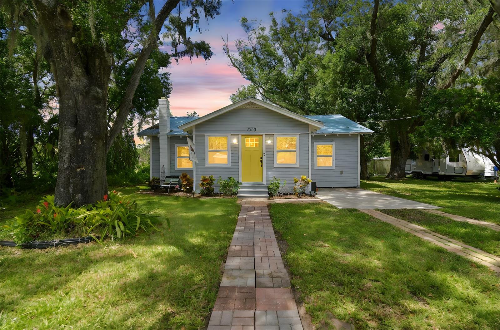 Professionally Designed. Beautiful Bungalow Home with all the new features you love. Just like an "HGTV" home. This is a home that you will be proud to invite family and friends over during the Summer and Holidays Seasons. Once you enter the home, your eyes will be drawn to the new "REAL HARDWOOD" Floors. You'll love how they flow throughout the home in the living room, dining room and bedrooms. The floors accents the SOLID BUTCHER BLOCK countertops. The kitchen has a Stainless Steel appliance package with a beautiful huge Cast Iron Farm Sink. The new All Wood Kitchen Cabinets are soft close with soft close drawers and topped with Crown Molding. Now, imagine standing at your sink, overlooking the LAKE in the PARK right outside your window, what an atmosphere! The bathroom has been updated fully to include tile flooring. The neighborhood is very safe, quiet and Kid friendly. You'll be minutes away from I-4 that gives you access to Downtown Tampa and Disney World just a short drive away. The METAL ROOF will give you peace of mind knowing it will last many years. New Hvac system and new duct work throughout will keep you cool! Store all your seasonal decor and lawn care equipment in the oversized custom built shed. You'll be living 20 feet from Cherry Street Park (next door neighbor). It's a very quiet, relaxing park that has a Walking Trail with a Fishing Lake that has huge fish stocked in it. Book your showing today, before its too late!