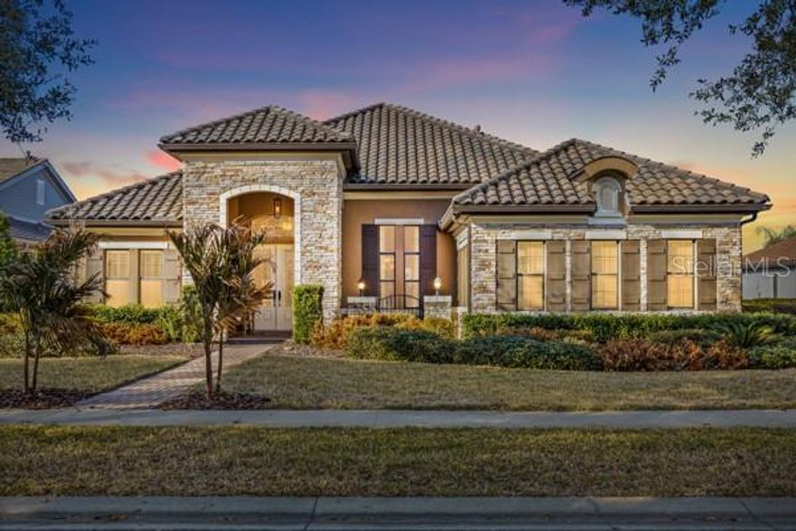 $10,000 TOWARDS BUYER’S CLOSING COSTS w/ Acceptable Offer! INCREDIBLE PRICE ON THIS POOL HOME! Located in the exclusive gated community of FishHawk Preserve, this luxury WestBay built home has 4 bedrooms, 3 full bathrooms, and a 3-car garage. Upon arrival, you'll notice this one-story ranch style home sits on an oversized lot, with striking features that include a stacked stone exterior, tiled roof, driveway and walkway pavers, and a side entry garage! Step inside into an open foyer, with tile floors, high ceilings, and crown molding throughout, and a private office enclosed with double French doors and formal dining room near the entryway. The home has a desirable open floorplan, with the kitchen overlooking the family room which centers around an electric fireplace with a stone mantle.  The kitchen features a center island with pendant lights, modern stainless-steel appliances with a gas cooktop and built-in oven, quartz countertops and tiled backsplash, and a walk-in pantry. The bedrooms are split with the primary suite offering a tray ceiling, spacious sitting room with French door to the lanai, and a dual walk-in closets. The en-suite bathroom includes a wide double sink vanity, tiled walk-in shower, and a separate garden tub. Towards the back of the home, there is a BONUS ROOM to use as a playroom, game room, or as flex space, with a glass slider for access to the pool! The pavered lanai is screened and has the SALTWATER POOL WITH SPA & OUTDOOR KITCHEN, with a grill, sink, and bar fridge, covered with plenty of space for outdoor seating. Zoned for all A-rated schools in a highly sought after area, this home truly has it all. Call today to schedule a private viewing!