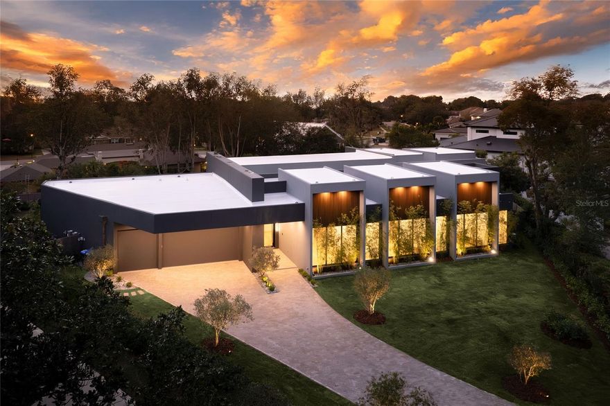 Unparalleled Luxury & International Design in Prestigious Bay Hill, Dr Phillips 
This newly developed, architecturally unique residence in Bay Hill is not merely a house—it is an iconic masterpiece and an internationally inspired designer art piece that redefines the zenith of luxury living in Orlando.

Your grand experience begins by passing through 10-foot modern pivot doors that open like magnificent stage curtains, revealing the home's spectacular scale: Italian hardwood planks grounded below soaring 20-foot ceilings. Sunlight floods the space, bathing a stunning indoor garden oasis with live mini olive trees—a breathtaking, bespoke element that sets an extraordinary tone for the entire estate.

The gourmet kitchen is a true chef’s fantasy, taking center stage with a full suite of Dacor high-end stainless-steel appliances, a sleek oversize waterfall island of impeccable design, and a discreet, built-in Zephyr wine refrigerator. Every curated detail whispers uncompromising sophistication.

Indulge in spa-quality opulence within the bathrooms, featuring exclusive Hansgrohe Axor fixtures and award-winning Duravit toilets. The master sanctuary is a haven of tranquility, complete with a double glass shower and a custom, hand-finished Dado soaking bath designed for ultimate rejuvenation.

Seamless, sophisticated living is achieved through massive sliding doors that effortlessly draw the interior and exterior together. Step out to a breathtaking backyard retreat boasting a dramatic 65-foot shimmering pool, a chic pool deck paved in luxurious Amazon green limestone tiles, and a professional-grade Summerset summer kitchen—perfectly appointed for grand-scale entertaining.

Sited within the ultra-exclusive Bay Hill community, known globally for its championship golf course and the yearly PGA Tournament, this estate places you moments from the world-class dining of Restaurant Row, luxury shopping, and Orlando’s renowned theme parks.

This is more than a property; it is an enduring work of art. An iconic masterpiece awaits. Contact us now to arrange your confidential private showing and experience its allure firsthand.