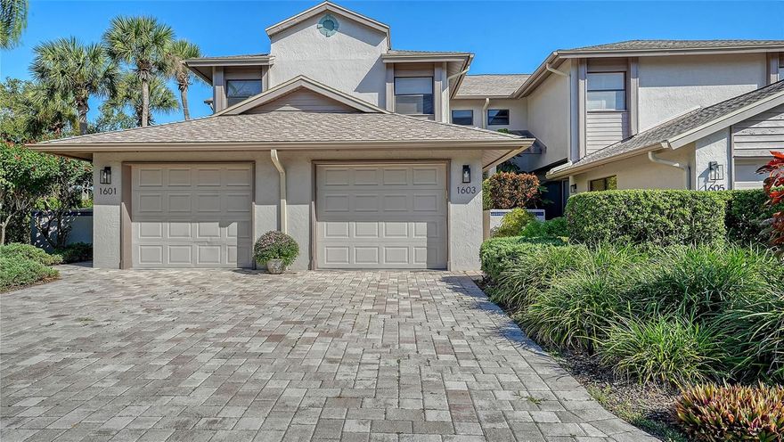 Opportunity awaits in this desirable end-unit Coach House in The Landings. Light-filled and inviting, this ground-floor end unit offers serene views of Phillippi Park Pond and the feel of a private backyard. Enjoy low-maintenance tile flooring throughout and an open floorplan that seamlessly connects the updated kitchen with the living and dining areas. An adjacent glass-enclosed Florida room provides flexible extra living space and sweeping views of the outdoors. The spacious master suite features room for a desk or sitting area, two closets, along with a generously sized bathroom, and a large walk-in shower. A separate guest bedroom, full guest bath, and laundry room complete this well-designed home. Relax on the sunny back patio and enjoy peaceful views of nature. Perfect as a seasonal retreat or year-round residence. Ownership includes membership to The Landings Racquet Club with 8 Har-Tru tennis courts, pool, hot tub, fitness center, library, and social activities. This gated west of the trail community is a hidden gem, centrally located, yet private.  Featuring mature landscaping, lakes, and a nature trail to a dock on the Intracoastal. Just minutes to Siesta Key, restaurants, shopping, and downtown Sarasota.