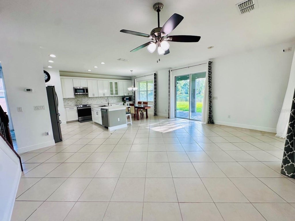 Photo of 10726 Cabbage Tree Loop, Orlando, FL 32825 (MLS # O6424557)