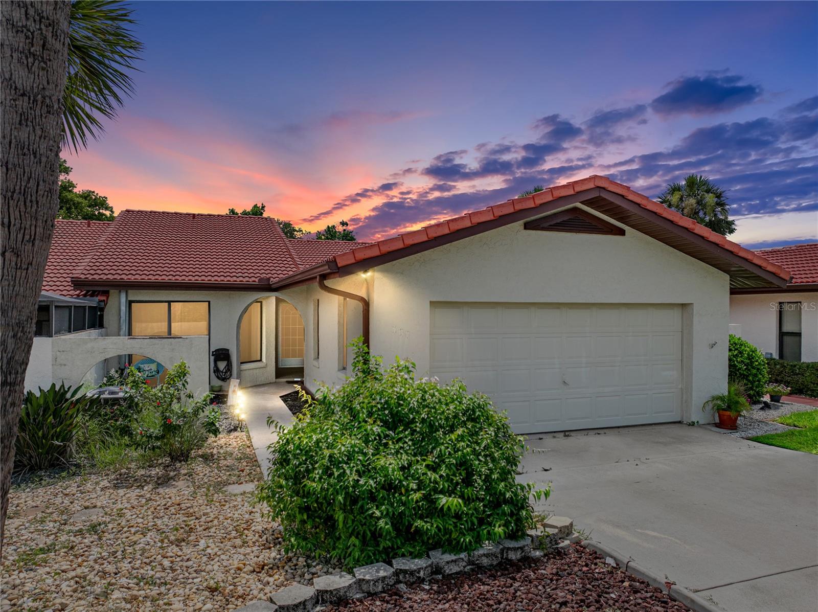 IMPRESSIVE VILLA in the beautiful Golfing Community at the Lake Wales Country Club! Enjoy Florida living in this elegant and spacious 2 BD/ 2 BA home with open floor plan, soaring ceilings, plus a fabulous lanai and patio with golf course frontage. This home boasts unique architectural features giving elegance and sophistication while making it an excellent home for entertaining family and friends. The open concept living areas feature stunning vaulted wood ceilings, tile flooring and an abundance of natural light from large windows and skylights. The gorgeous kitchen was renovated with handsome wood cabinetry allowing for a desk and extra storage, lengthy granite countertops, tile backsplash and stainless appliances including a gas range. This is a perfect home when entertaining, the living area expands onto a lovely screen lanai that opens to a paver-stone patio. The private master en suite has access to the lanai and offers dual closets, one is walk-in; the spacious bathroom has split sink vanities, jetted garden tub and a large walk-in shower. The 2nd bathroom stands convenient to living areas and the guest bedroom with sliding glass doors leading to a quaint courtyard. Relax and enjoy a fabulous Florida lifestyle at this impressive home with a great floor plan. Enjoy the peace and quiet, the golf course and the community clubhouse that offers a screened-in heated pool. The Lake Wales Country Club membership is optional to enjoy the Donald Ross designed 18 hole championship golf course, pro-shop, restaurant, lounge and tennis courts. Outstanding Central Florida location, travel SR Hwy 60 or US Hwy 27 for metro areas or beautiful Florida beaches.