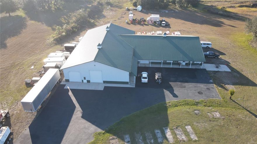 This unique property is a compound/farm, registered as an agricultural property. This property also has a Motorcross track that can be re-established with the county. Two addresses are associated with the property. The second address is 7221 SW 55TH ST. Bushnell, FL

Distinguished Features:
    •    Sweeping Acreage & Idyllic Natural Assets:
Sprawled over 68.75 pristine acres, the estate boasts a captivating 5-acre dredged swamp—an inviting venue for avid hunters—and a serene 4.45-acre lake. The property is also zoned to be redeveloped into 5-acre parcels that can be built on, if the new owner wishes.
    •    Two single-family residences encompassing 11,821 square feet of combined living space with elegant outdoor Living are on the property, along with a 7,000+ sq. ft. Morton pole barn.  
    •    Primary Residence:
The first SFH is constructed of block with a metal roof. This home features 2 bedrooms and 2 bathrooms, accentuated by vaulted ceilings in the living, kitchen, and dining areas. The inviting porch area further enhances the living experience, providing a tranquil space to savor the scenic surroundings.
The second SFH is constructed of metal siding, and a metal roof. This home features 4 bedrooms, 2 full bathrooms, and a half bathroom. Encompassing vaulted ceilings throughout the main living areas, providing an open, airy feel to the space. 
    •    Morton Barn & Warehouse:
Exemplifying top-tier craftsmanship, the barn is a Morton masterpiece designed with hurricane-resistant construction and a sleek metal roof. Offering 7,000 square feet of meticulously organized warehouse space. The warehouse area is artfully segmented into four distinct areas, featuring:
    •    Five generous RV garage bays situated on the largest sections flanking both sides,
    •    Additional garage bays and a dedicated storage area,
    •    An expansive porch that mirrors the outdoor area of the primary home.
    •    Exclusive Recreational Opportunities:
The estate is further distinguished by 1.7 miles of dedicated dirt bike track. Prospective buyers may secure a special-use permit for this unique amenity, or alternatively opt to have the track flattened to better suit their personal vision.