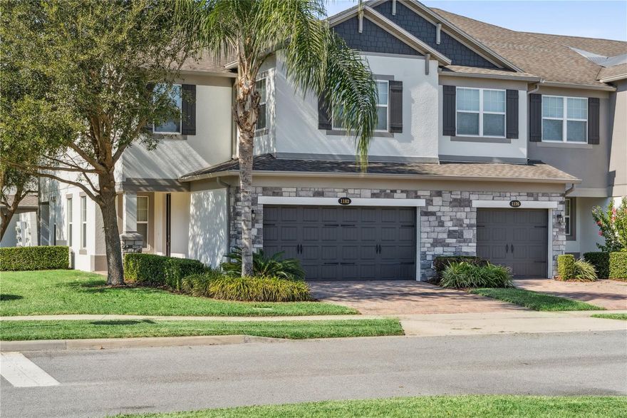 Welcome to this stunning end-unit townhome located in the highly sought after gated community of Hickory Hammock in Winter Garden. This beautifully maintained 3-bedroom, 2.5 bath residence with a 2-car garage offers a spacious and functional layout with designer finishes throughout. Step inside to find wood plank tile flooring that flows through the entire first floor. The entry level features a private office, a half bath with pedestal sink, and a bright, open great room with a ceiling fan and sliding glass doors leading to the patio. The kitchen is a chef’s dream, complete with raised panel white shaker cabinets accented by brushed nickel hardware, GE stainless steel appliances, granite countertops, tile backsplash, a walk-in pantry, and an inviting eat-in dining area. Upstairs, a spacious loft offers flexible living space, perfect for a media area or playroom. Two guest bedrooms, each with ceiling fans and ample closet space, share a full bathroom featuring tile floors, double sinks with quartz counters, and a tiled shower/tub combination. The primary suite is a true retreat, highlighted by double entry doors, a ceiling fan, and a spa like ensuite bath featuring tile floors, dual quartz vanities, a glass-enclosed tile shower, garden tub, and a large walk-in closet. The laundry room, complete with GE washer and dryer, adds convenience. In addition to the 2-car garage, the townhome enjoys an ideal location bordered by extra parallel parking and a spacious green area with mature trees, perfect for playtime or walking your dog. Plus a NEW ROOF in 2025! Residents of Hickory Hammock enjoy resort-style amenities including a zero entry community pool, clubhouse, fitness center, tennis and volleyball courts, fishing pier, playgrounds, parks, walking trails, and a dog park. With top rated schools, close proximity to downtown Winter Garden, Winter Garden Village, and just 20 minutes to Disney and 30 minutes to the airport, this home combines luxury, comfort, and convenience offering the best of Central Florida living. Schedule your private showing today and experience all that this beautiful home and community have to offer!