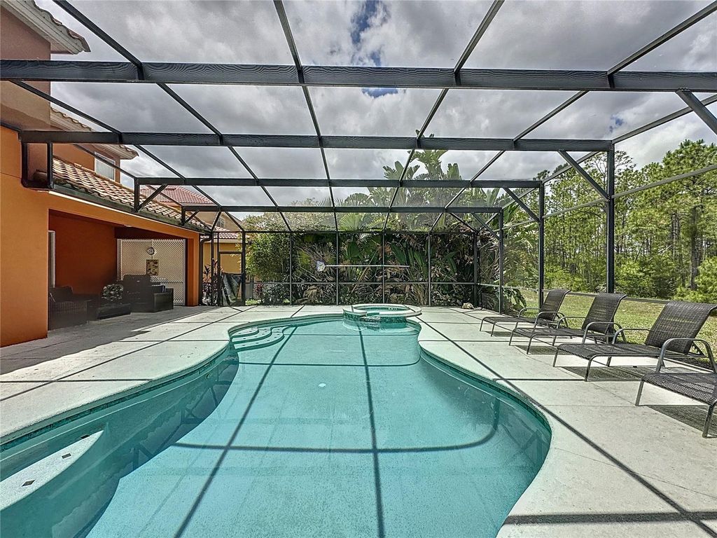 Photo of 394 Orange Cosmos Boulevard, Davenport, FL 33837 (MLS # S5140660)