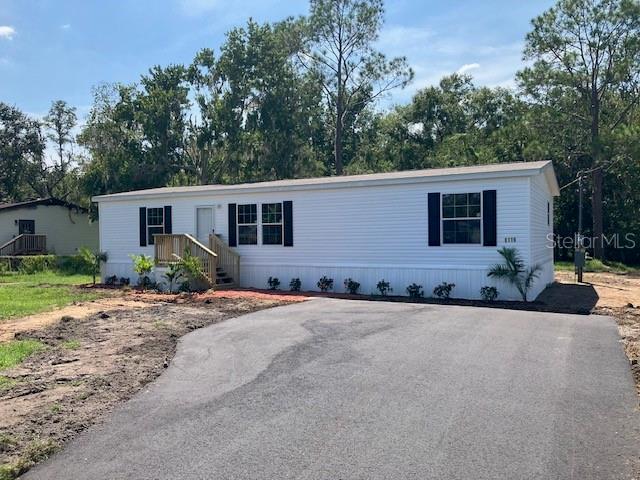 Brand New Home a 2025! Don't miss out. Everything New New New, this double wide sits on just over 1/2 acre (.53) in the Angus Valley area. Great Location, with a country feel, conveniently located near shopping, malls, schools, I75, great restaurants.. No HOA and no CDD fees New A/c , all bedrooms have walk in closets, Newly landscaped, and new wood decks on both front and back of home, great for entertaining or family BBQ's and is fenced on 3 sides. this 3 bedroom two bath home has a split bedroom plan, Large Kitchen with plenty of cabinet space, separate island, all new appliances. This home shows great and easy to show and won't disappoint