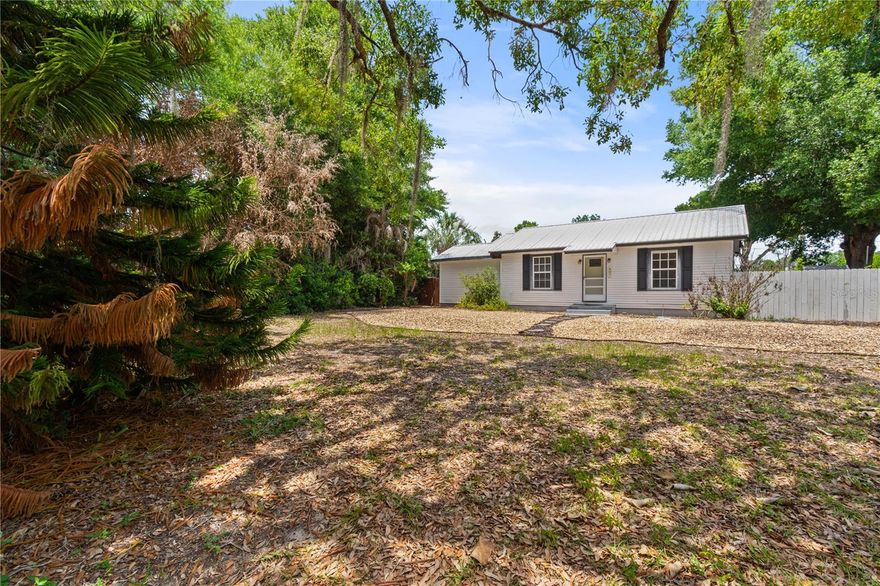 Tucked away behind lush landscaping and privacy fencing, this enchanting 1948 pool home is truly a hidden gem! Beautifully renovated while preserving its timeless charm, this 3-bedroom, 2-bath residence offers warmth, character, and inviting spaces both inside and out.

The spacious eat-in kitchen is the heart of the home, featuring abundant natural light and a charming butler’s pantry that adds both style and function. The living area flows effortlessly to the screened and heated pool and patio space, creating the perfect backdrop for entertaining, relaxing evenings, or year-round enjoyment.

The thoughtfully designed primary suite offers hardwood floors, a walk-in closet, and updated bath complete with a Jacuzzi tub, separate tiled shower, and double vanity. The additional bedrooms are generously sized and continue the warmth of the home with classic hardwood flooring.

Outside, the fenced corner lot feels like a private retreat with lush tropical landscaping and patio area, covered parking, and additional space for guests. A dedicated laundry/workshop area adds extra versatility and storage.

Perfectly positioned within the city limits of Lake Wales, this home combines vintage character, modern comfort, and a peaceful setting all in one unforgettable property