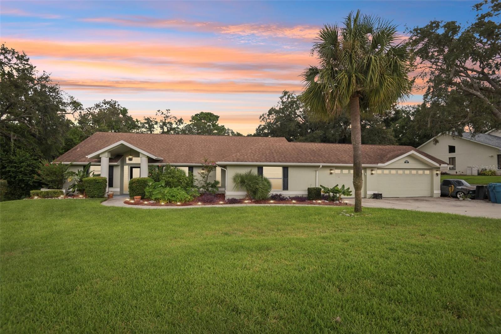 One or more photo(s) has been virtually staged. This beautiful Linden Estates home offers a spacious floor plan with 4 large bedrooms, plus an office, 2 full bathrooms, a 3 car garage, plus a screened in Pool with covered lanai, all on a half acre set in a quiet picturesque neighborhood. The spacious, open kitchen welcomes you with counter seating, granite countertops, tall 42” kitchen cabinets with crown molding and accent glass doors. The stainless steel GE appliance package includes the side by side refrigerator with ice maker, microwave, dishwasher, and double oven for easy holiday meals. Single lite French doors open from the breakfast nook to the pool deck, making hosting gatherings fun and easy. This floor plan punches above its size, with an open formal great room and a large family room off the kitchen all with Vaulted ceiling and transit windows to let in the light. The laundry room is located right off the kitchen and family room, and offers a large closet and cabinets for extra storage. The primary suite has two closets, one with built in wood shelves, a deep garden tub and a separate walk in shower. The half acre property includes a separate enclosed tree lined dog run with plenty of shade. Tropical landscaping surrounds the pool, and majestic mature oaks in the backyard providing a scenic and cool outdoor escape. The wide driveway and three car garage provide plenty of space for all your vehicles and toys as well as room for storage. The garage is painted and the floor is upgraded with epoxy. The private office has plenty of storage space and a window overlooking the garage - perfect for auto enthusiast, a hobby room, or remote work. The community park is less than half a mile up the road and offers a beautiful trail, tennis/pickleball courts, and a swing set. This home is vacant and ready for quick move in. Tour today! Mortgage savings may be available for buyers of this listing.
