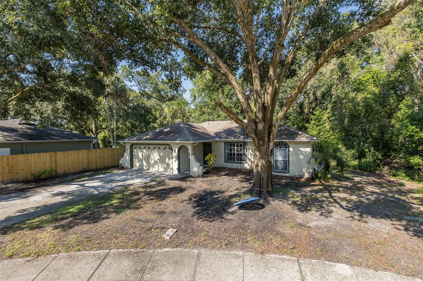 Welcome to this move-in ready home, an ideal opportunity for first-time buyers or those looking to make a home their own. Nestled on a quiet cul-de-sac with mature landscaping and peaceful conservation views, this 3-bedroom, 2-bath home offers a spacious split-bedroom floor plan and open living areas. The fully fenced backyard and screen-enclosed patio provide great outdoor space for relaxing or entertaining. The home is located near all amenities including restaurants, beaches, medical facilities and just a short commute to Tampa International Airport. Major expenses have been taken care of by the sellers. Recent updates include a new roof (2019) and water heater (2019), a new AC system (2021), and a completely renovated walk-in shower in the primary suite in 2025. Luxury vinyl was added new in main living areas in 2020 and then in primary bedroom in 2021. With solid bones and a fantastic location, this home is ready for your personal touch and future memories. SCHEDULE YOUR SHOWING TODAY!!