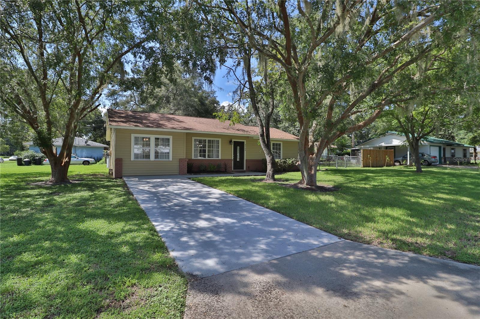 Welcome to 6700 SE 38th Court—where modern comfort meets small-town serenity. Tucked away in southeast Ocala's friendly Edgewood neighborhood, this 3-bedroom, 1-bath concrete block residence rests on a lush, expansive corner lot. Inside, discover a fully revitalized interior: from sleek tile floors underfoot to crisp new countertops, appliances, and fixtures throughout. Freshly painted inside and out, the home radiates warmth and move-in readiness. With an open layout merging living and dining spaces, space-efficient bedrooms, and a well-appointed kitchen, this 1,104 sq?ft home balances style with simplicity. You’ll enjoy the peace and privacy afforded by a fenced yard, handy storage, and driveway parking. Whether you're a first-time homeowner, downsizing, or investing, this home delivers—blending convenience, quality, and potential in a prime Ocala setting. Don’t let this gem slip away—schedule your showing and fall in love with your future home!