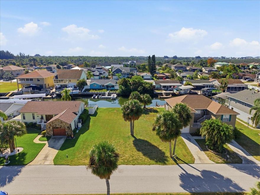 Imagine waking up every day on your own piece of Florida’s west coast. This VACANT WATERFRONT lot in Hudson offers 60 FEET OF SEAWALL with direct canal access to the Gulf of America, making it the perfect spot for anyone dreaming of a COASTAL LIFESTYLE. The property is cleared, level, and ready to build, giving you the freedom to design the home you’ve always wanted. Whether you're planning a weekend getaway or a full-time waterfront retreat, this location offers quick BOATING ACCESS, stunning sunsets, and the laid-back Gulf atmosphere that makes this area so popular. Bring your plans, bring your boat. Your Florida waterfront lifestyle starts right here.