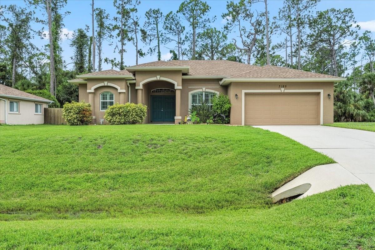 This 2016 built 3 bedroom, 2 bathroom, POOL home is in the PERFECT LOCATION in North Port, with quick access to both US 41 & I-75! This home is on a QUIET STREET, NOT IN A FLOOD ZONE and there are NO CDD or HOA FEES in this neighborhood. BRAND NEW AC! The soaring ceilings, split floor plan, and the open kitchen create an inviting atmosphere- perfect for entertaining your guests. The kitchen features BRAND NEW granite countertops, white cabinets, stainless appliances, new backsplash, closet pantry, and HUGE ISLAND with plenty of seating. To the left of the foyer is the entrance to the primary suite with soaker tub, separate shower, linen closet, dual walk-in closets and sliders leading out to the lanai. On the opposite side of the home you’ll find two spacious bedrooms and a guest bathroom with shower/tub combo. The owners have installed new luxury laminate flooring throughout all of the main areas and bedrooms, and tile in the bathrooms. The entire home has been recently painted and a fireplace feature wall has been installed in the family room. Additional features include updated light fixtures, crown molding, and plantation shutters throughout the entire home. Three sets of sliding glass doors in the main living areas lead out to your very own heated saltwater pool with plenty of deck space to entertain your guests! Near the kitchen is the entrance to the laundry room which leads to the 2 car garage. For peace of mind during storm season, there are hurricane shutters for all windows. This home is not in a deed restricted community so bring your RV, boat, and pets! Located near great schools, award winning golf courses, and several parks and playgrounds nearby. Coco Plum plaza is just around the corner with its many shops and restaurants. North Port aquatic center is also in close-proximity, with heated pool, waterpark, and discounted entry for North Port residents! Within the city of North Port, you will also find downtown Wellen Park— featuring the Atlanta Braves Spring Training Stadium! Downtown Wellen is situated around a huge lake with walking/jogging paths, kayak rentals, shopping, restaurants, food trucks, splash pad, playground, Sunday farmer’s market, and tons of events! A short thirty minute drive will bring you to Venice Island, with it's beaches, charming boutique shops, dining options, Venice Little Theater, fishing pier, Saturday farmer’s market, and so much more! Schedule your showing today and start living the Florida lifestyle! **There are solar panels on the home which help with cost of electricity/heating the pool. Ask realtor for details regarding this!**