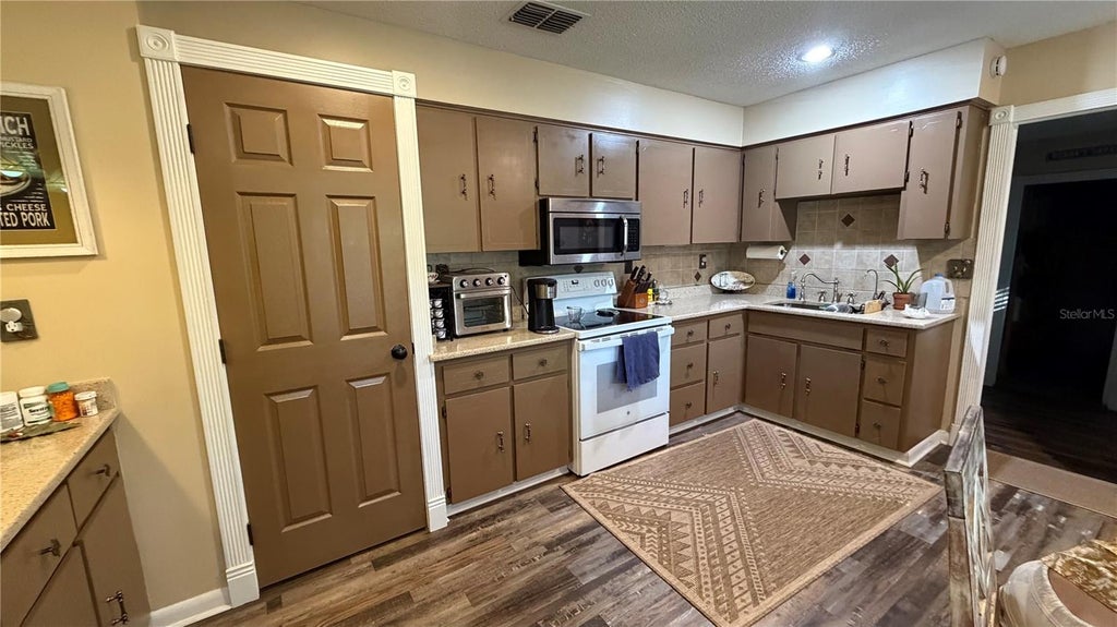 Photo of 12325 Hicks Road, Hudson, FL 34669 (MLS # TB8561298)