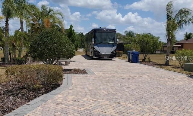 This RV Pad is in a great location in the community. Not far from the entrance and the clubhouse. On a quiet less traveled road, it features a larger than average lot giving the new owners plenty of room to build a home someday if desired. The property has plenty of mature trees around the patio area for a little shade during the hotter months. Call to see this property and own it right in time for the winter season!