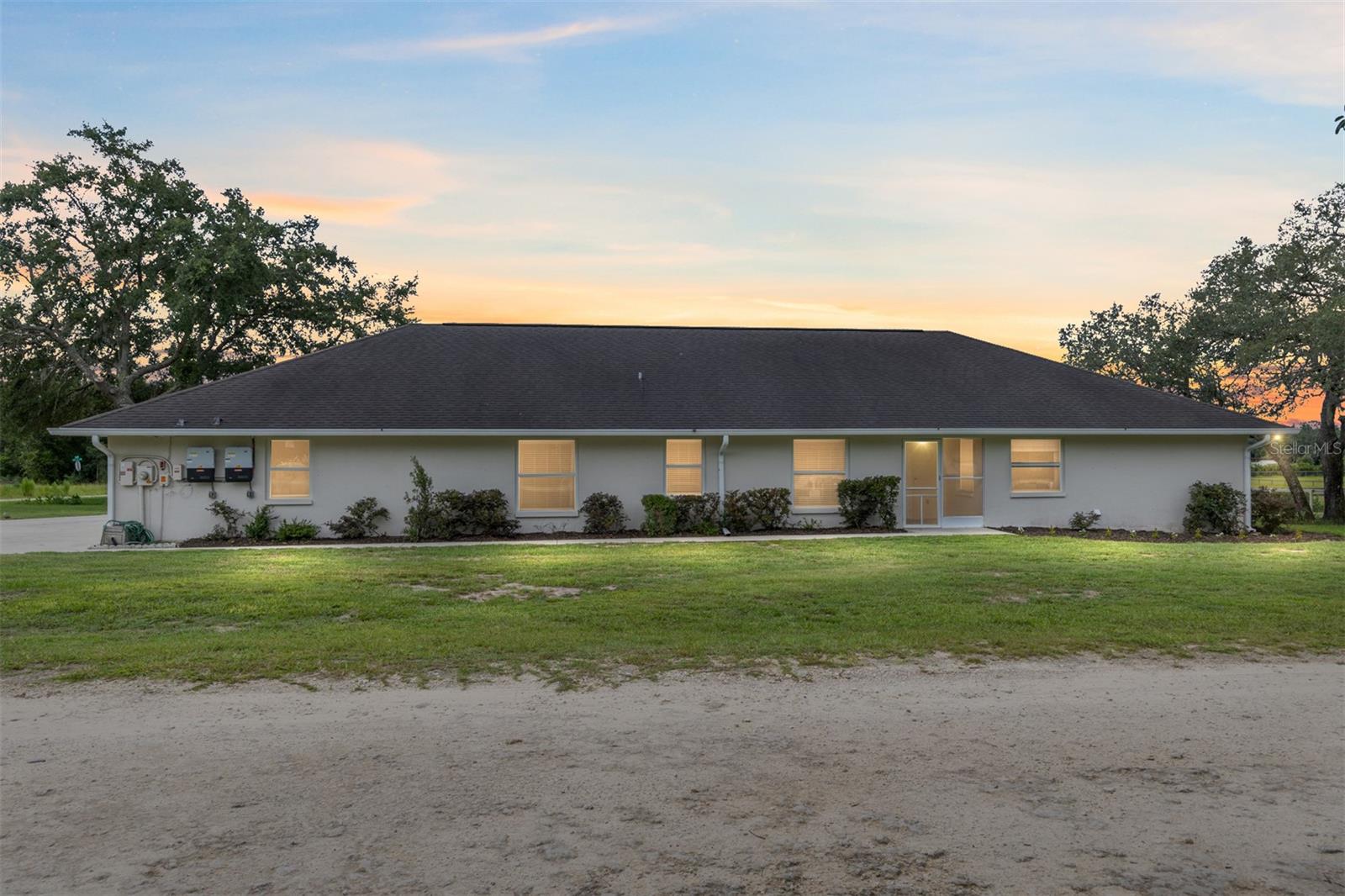 If you're looking for elbow room, sunsets, and freedom from HOA rules — this 1.61-acre farmette in Williston might just be your next adventure. Tucked back off the main road, this spacious property offers a little bit of everything: a large pool home, equestrian amenities, and even the opportunity for future income potential. The 4-bedroom, 3-bath main home features a beautifully remodeled kitchen that opens to an inviting outdoor cabana and summer kitchen — the true heart of the home. The primary and one guest bath have been tastefully remodeled and the spacious living room makes for a great entertainment area. Out back, you’ll find a long pole barn with three 12'x12' horse stalls, a tack room, and an unfinished 2 bed / 1 bath apartment — perfect for a future guest suite, rental, or multi-generational living. Need storage? You’ve got four covered bays for your RV, horse trailer, or equipment. The land includes four paddocks, a
chicken coop, two storage containers, and a small arena ready for your horses or hobbies. Enjoy peaceful pasture views with unforgettable sunsets from your pool and a location that offers easy access to downtown Williston, the Williston Airport (private planes welcome!), and trails in Goethe State Forest. Come with your creativity and see the vision – this one has the space, the flexibility, and the location to be something really special.
