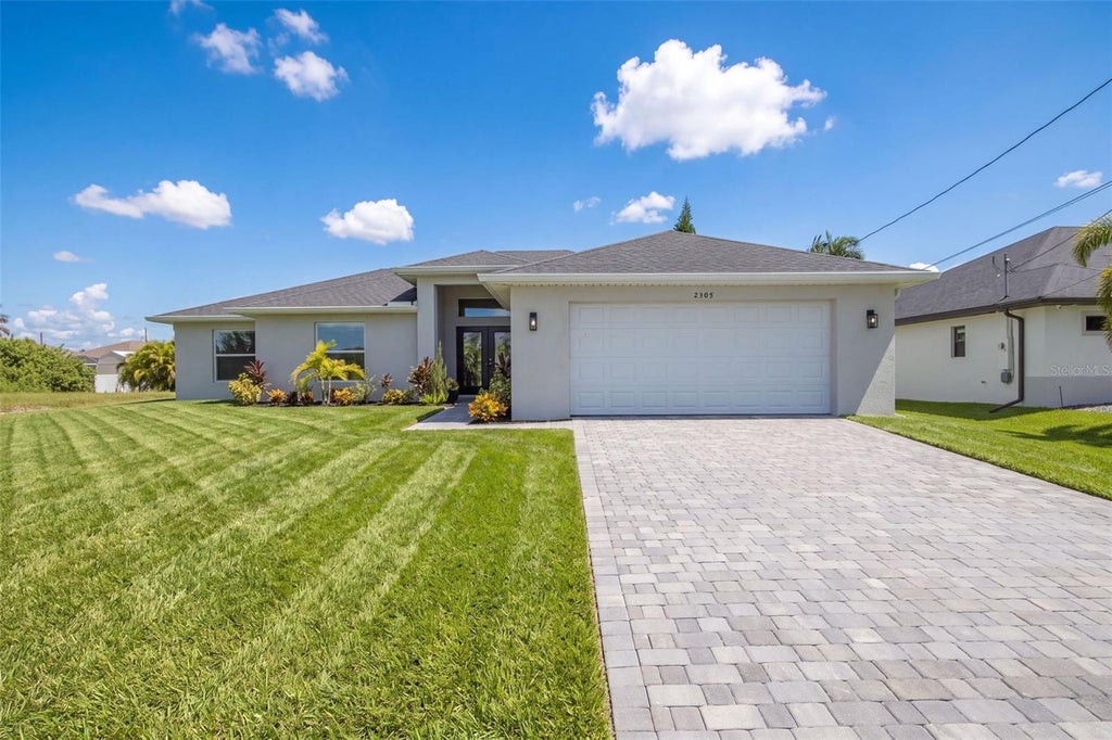 Photo of 2305 NW 34 Avenue, Cape Coral, FL 33993 (MLS # O6439493)