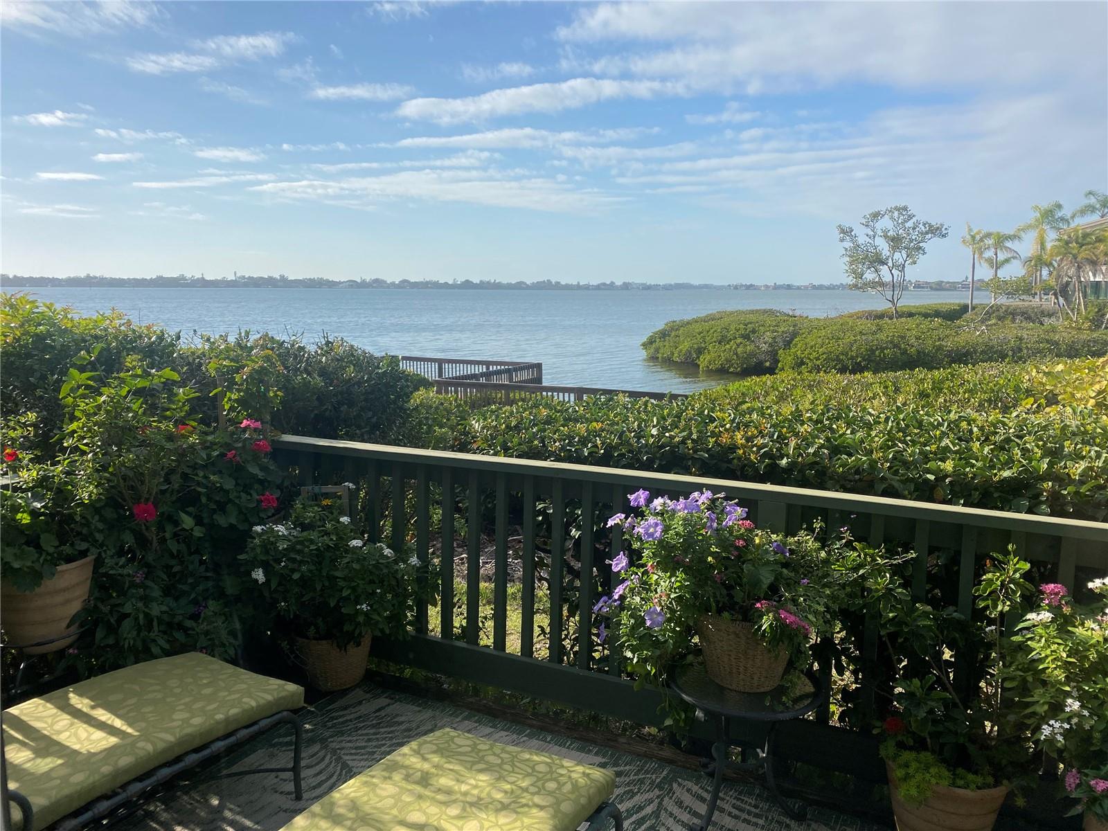 Fully renovated 2 bedroom/2 bath first floor waterfront condo overlooking Clower Creek and Sarasota Bay. Enjoy daily sightings of pelicans, egrets, and herons; manatees in the channel and sunsets. This spacious two bedroom/two bath condo is filled with plenty of natural sunlight so that you can enjoy panoramic Sarasota Bay sunsets from your own private back deck. Kitchen has been fully renovated with added extra storage and counter space.  As you drive past the gate, the lush tropical setting, fruit trees, bird watching and manatee sightings in the harbor will offer instant serenity and relaxation. Amenities include: art studio, woodworking shop, sculpting garden, 6 pools, yoga, tennis, pickleball, water aerobics, biking, new exercise room and kayak launches to name a few activities. Enjoy an impressive offering of performing arts, annual art show, cinema & culinary club, bridge and fiber arts club.